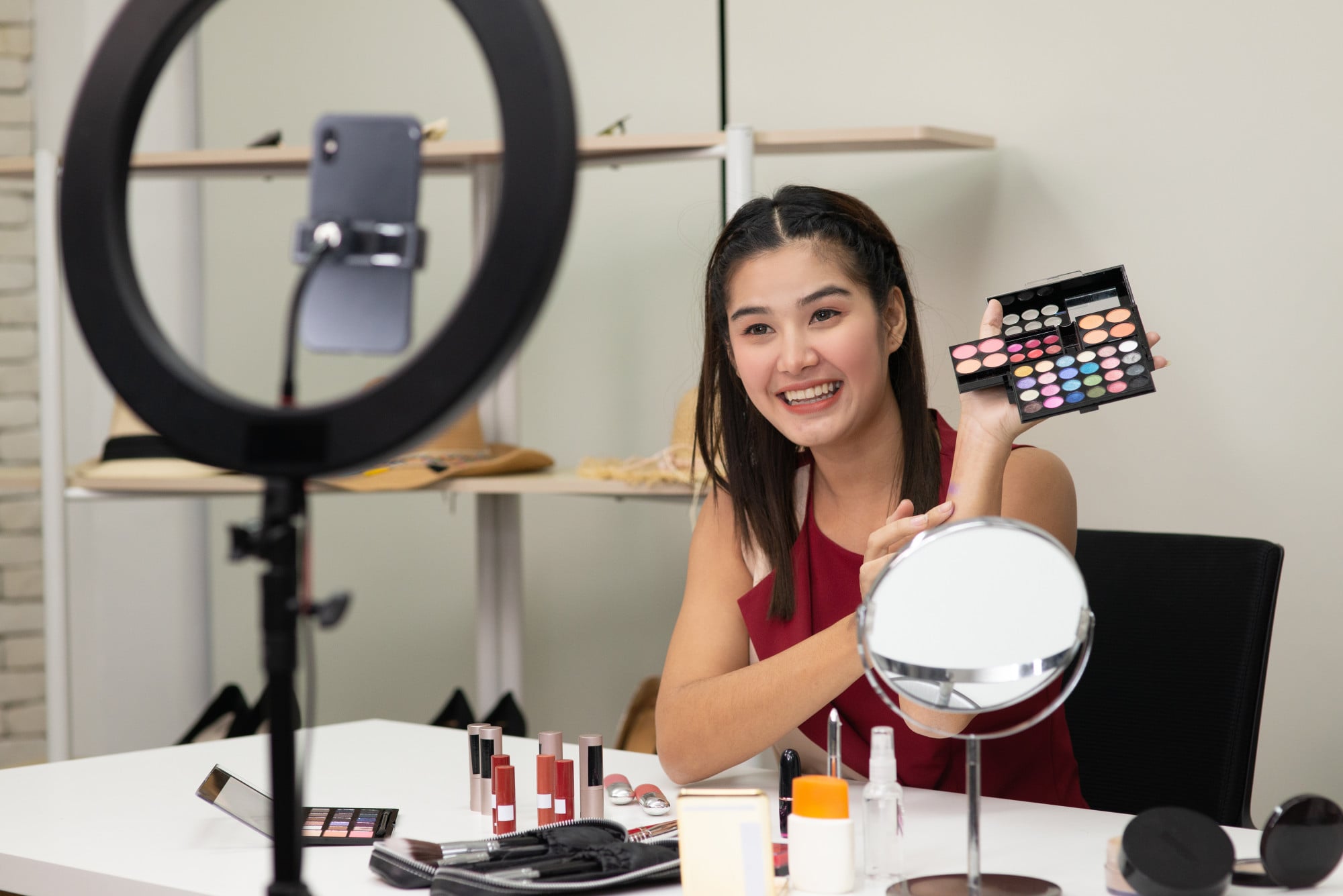 Another make-up influencer advertises cosmetic products during a live-stream. Photo: Shutterstock Another make-up influencer advertises cosmetic products during a live-stream. Photo: Shutterstock