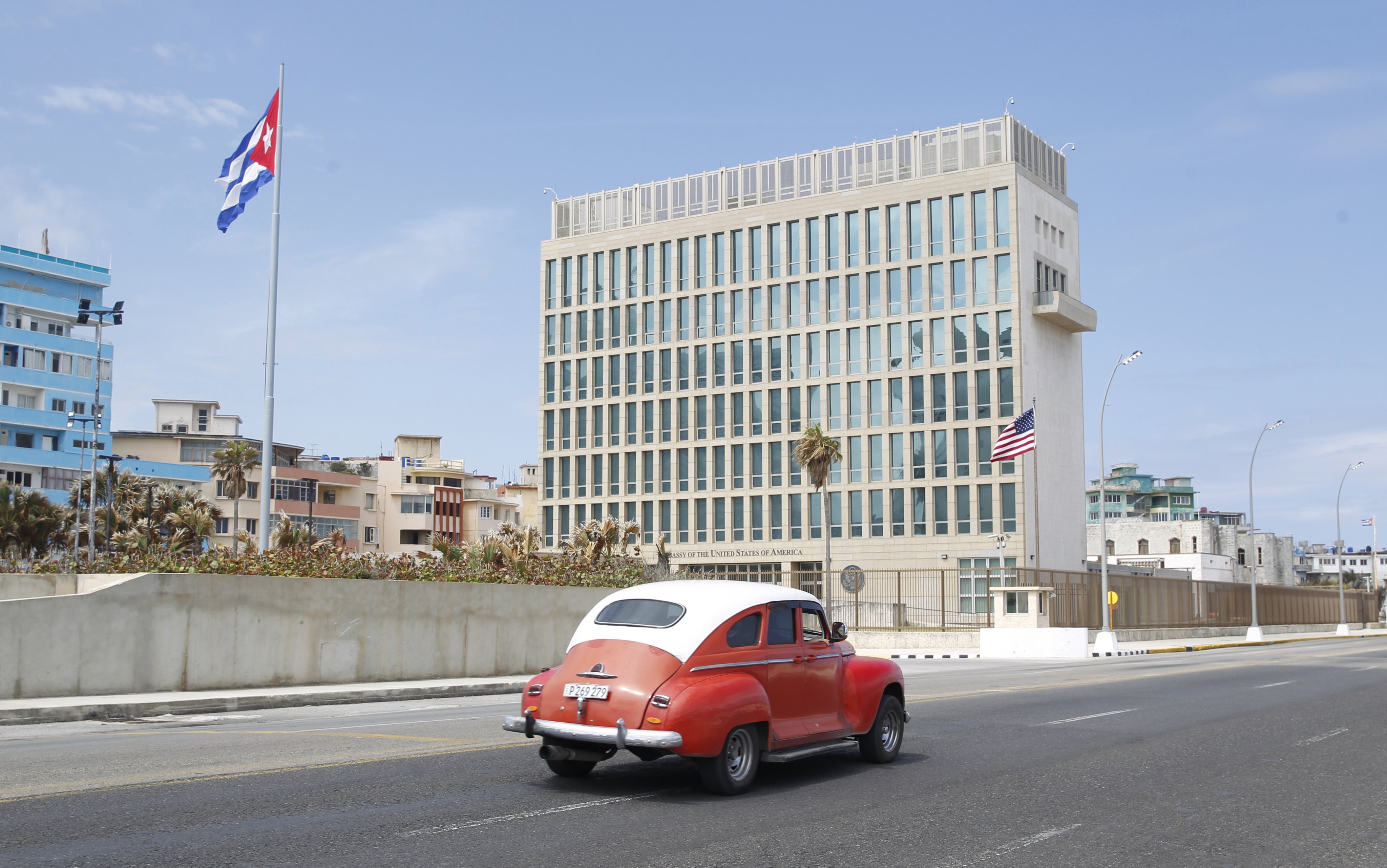 An old car drives past the US embassy in Havana, Cuba, as geopolitical tensions flare between the two nations. Photo: EPA