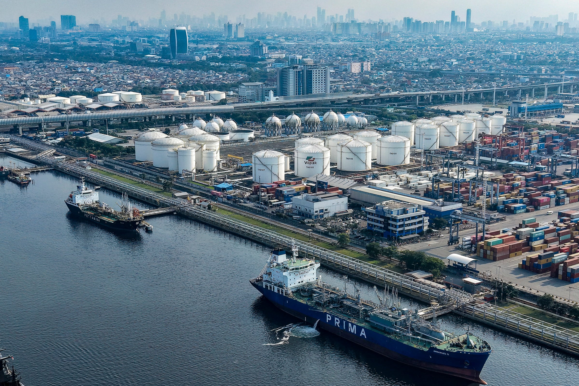 Oil tankers and cargo ships are seen at the oil depot and container terminal of Tanjung Priok Port in Jakarta, Indonesia, on March 31. Photo: AFP/Getty Images/TNS