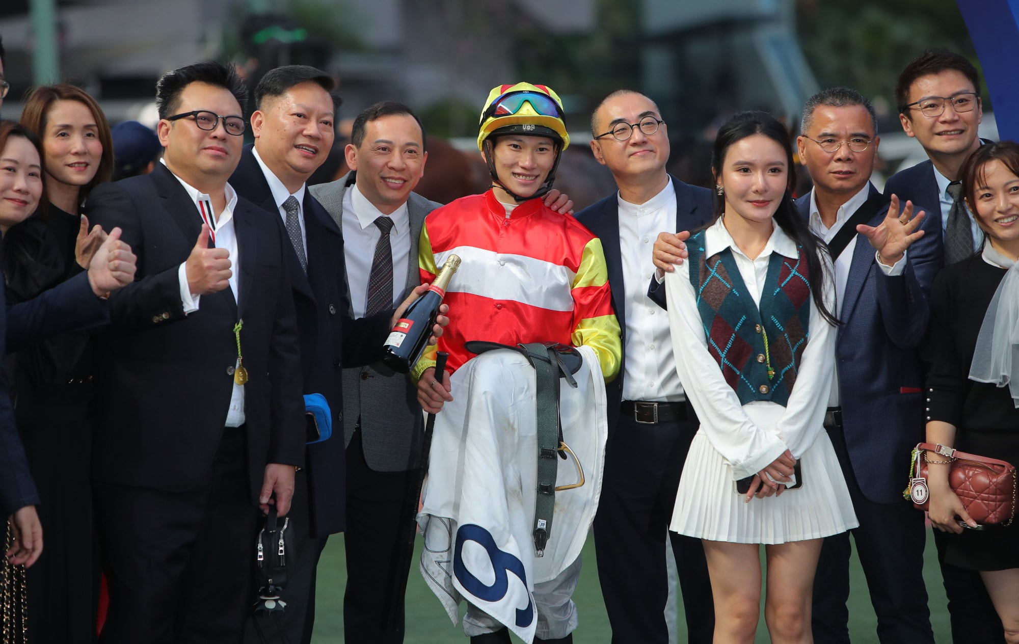 Connections celebrate the win of Emblazon at Sha Tin. Connections celebrate the win of Emblazon at Sha Tin.