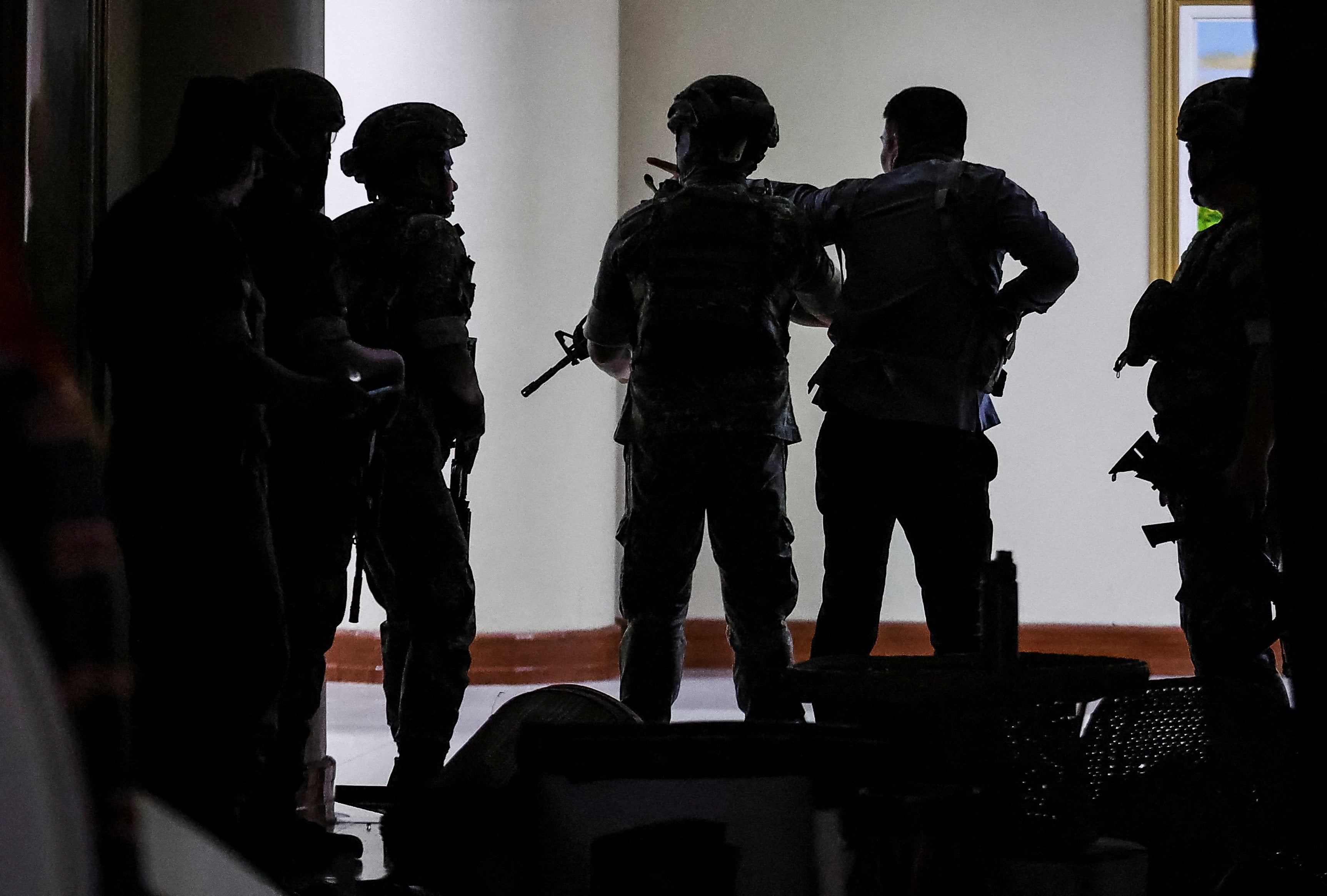 Military personnel  enter the Philippine Senate building where Senator Ronald dela Rosa is under protective custody on Wednesday. Photo: Reuters