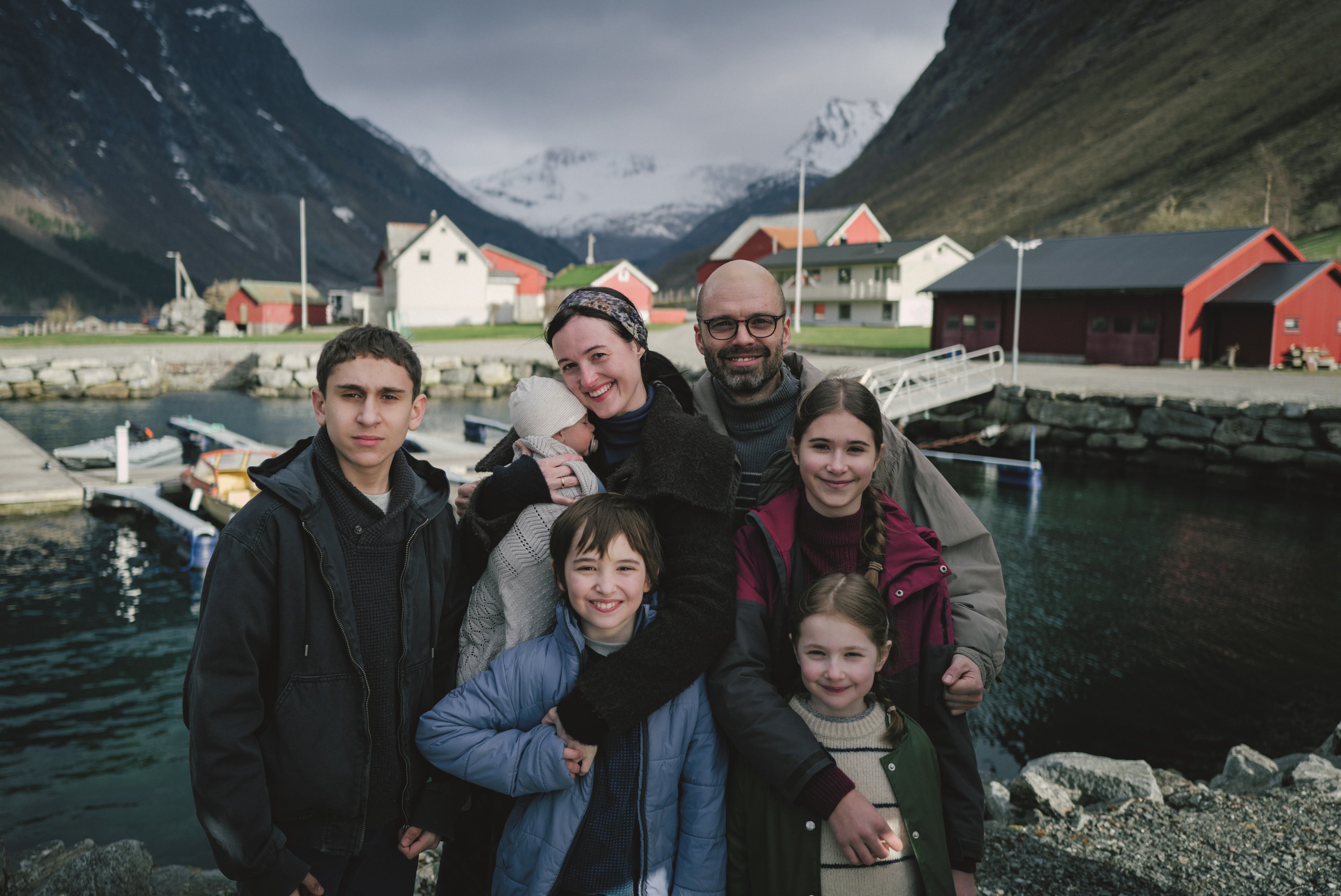 Renate Reinsve and Sebastian Stan play a married couple with five children in the film Fjord, directed by Cristian Mungiu. Jonathan Ciprian Breazu (far left) and Vanessa Ceban (right) co-star.