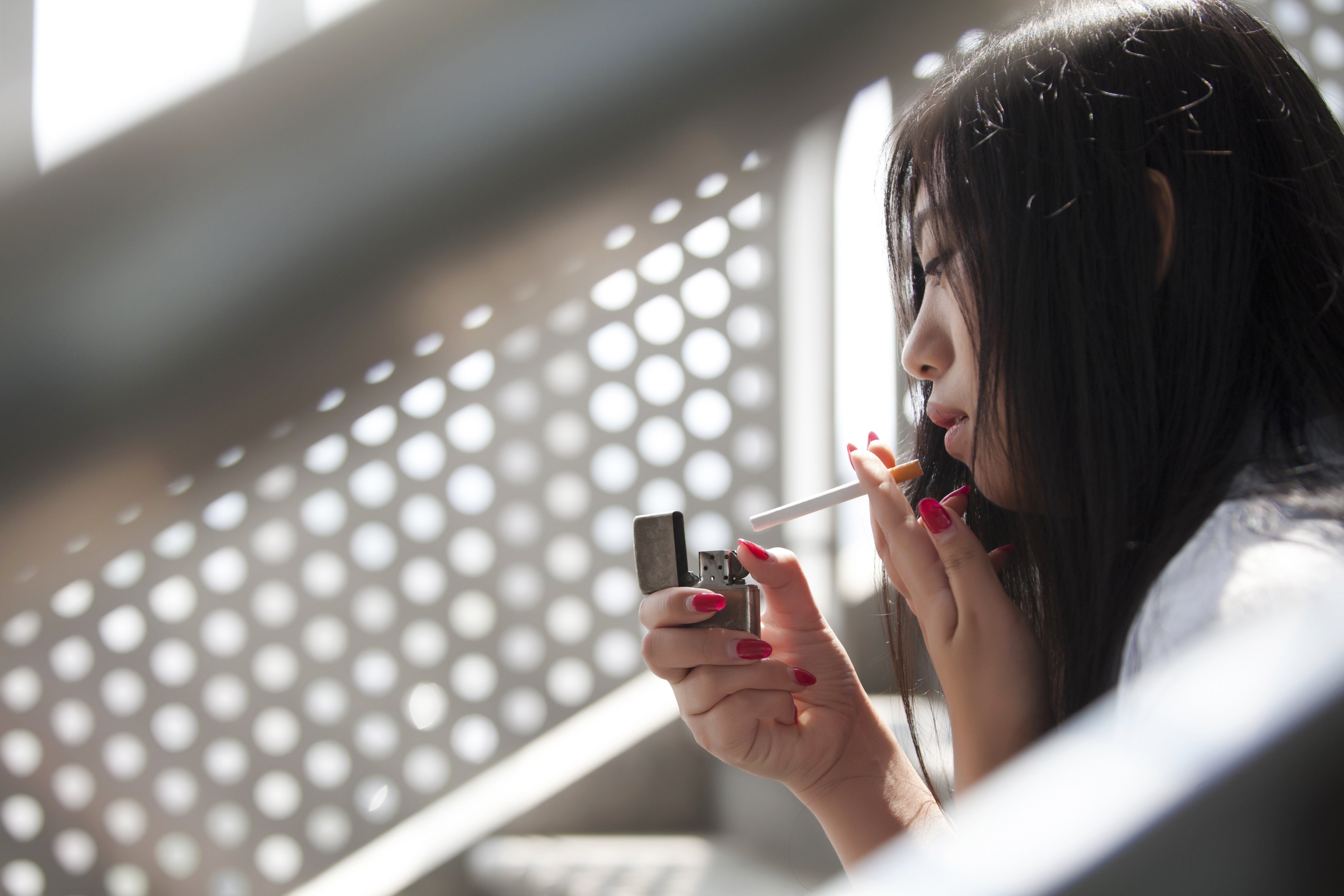 A university student in China complained about the lack of benches in the smoking area, reigniting heated debates about public smoking. Photo: Shutterstock