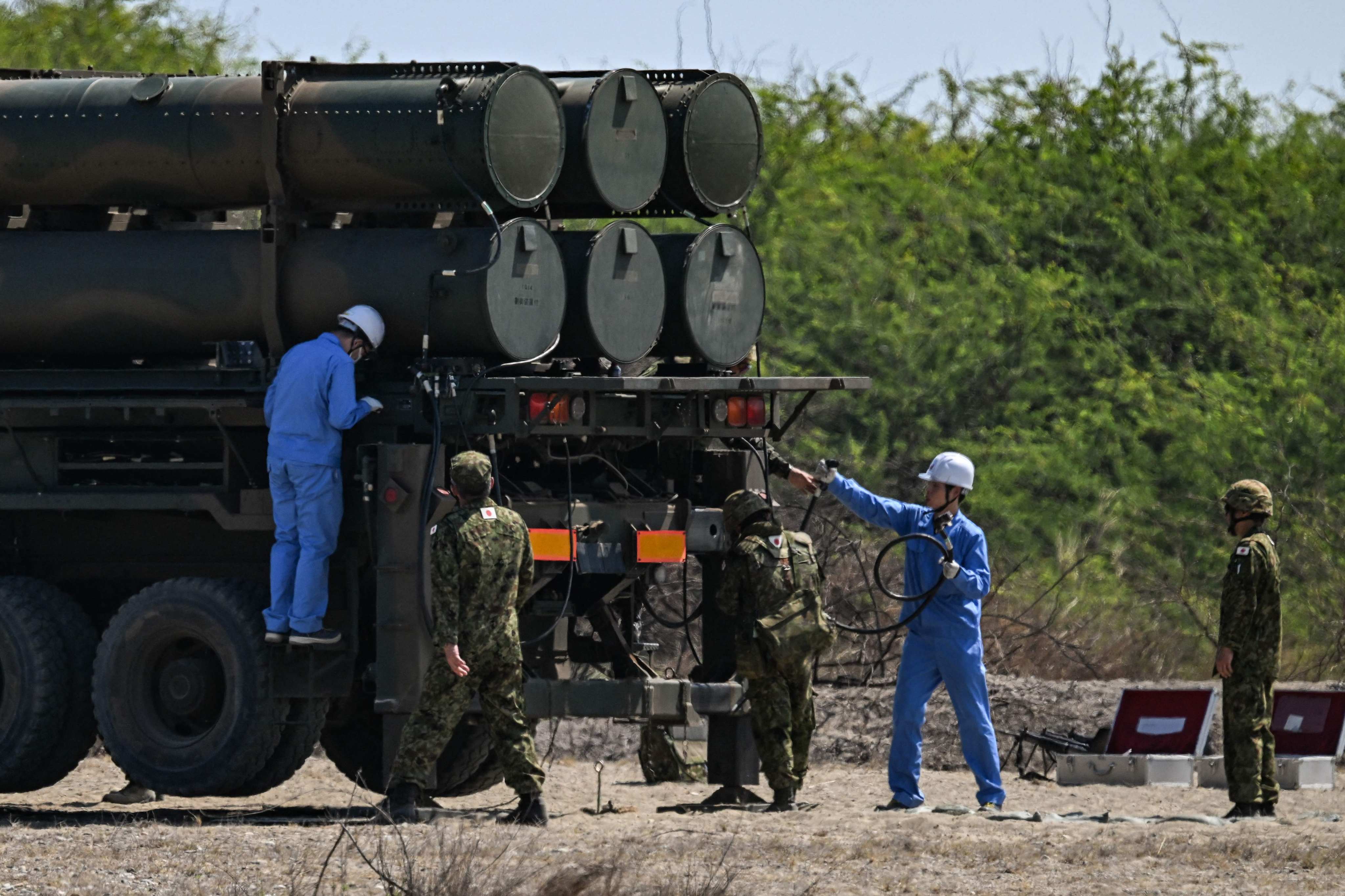 Japanese soldiers prepare a Type 88 surface-to-ship missile system for firing in the Philippines on May 6. Photo: AFP