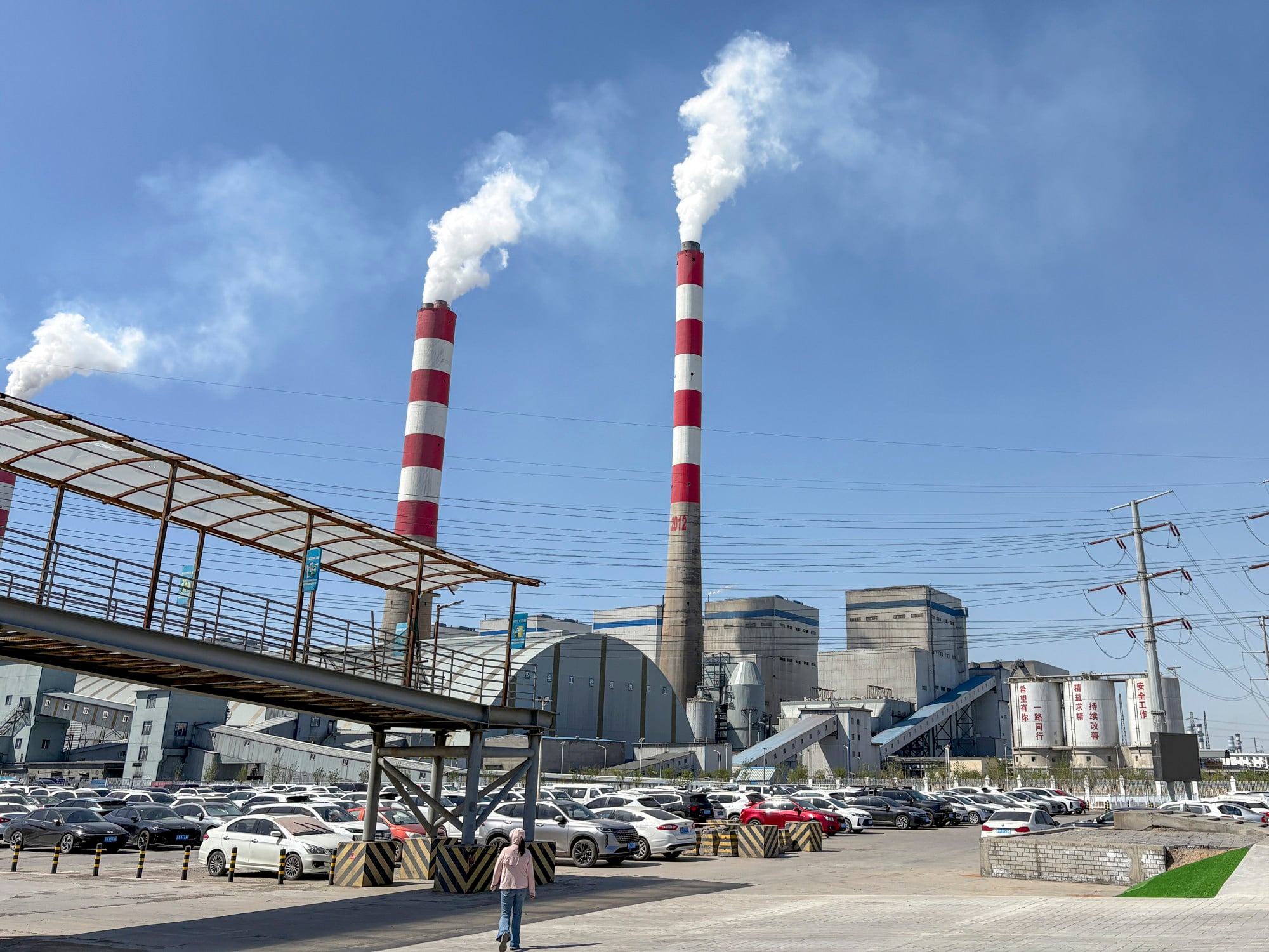 Smoke plumes rise into the sky above Wucaiwan as the world’s largest and most cutting-edge power plant converts coal into liquid fuel, clean gas, plastics, chemical fertilisers and more. Photo: Dannie Peng Smoke plumes rise into the sky above Wucaiwan as the world’s largest and most cutting-edge power plant converts coal into liquid fuel, clean gas, plastics, chemical fertilisers and more. Photo: Dannie Peng