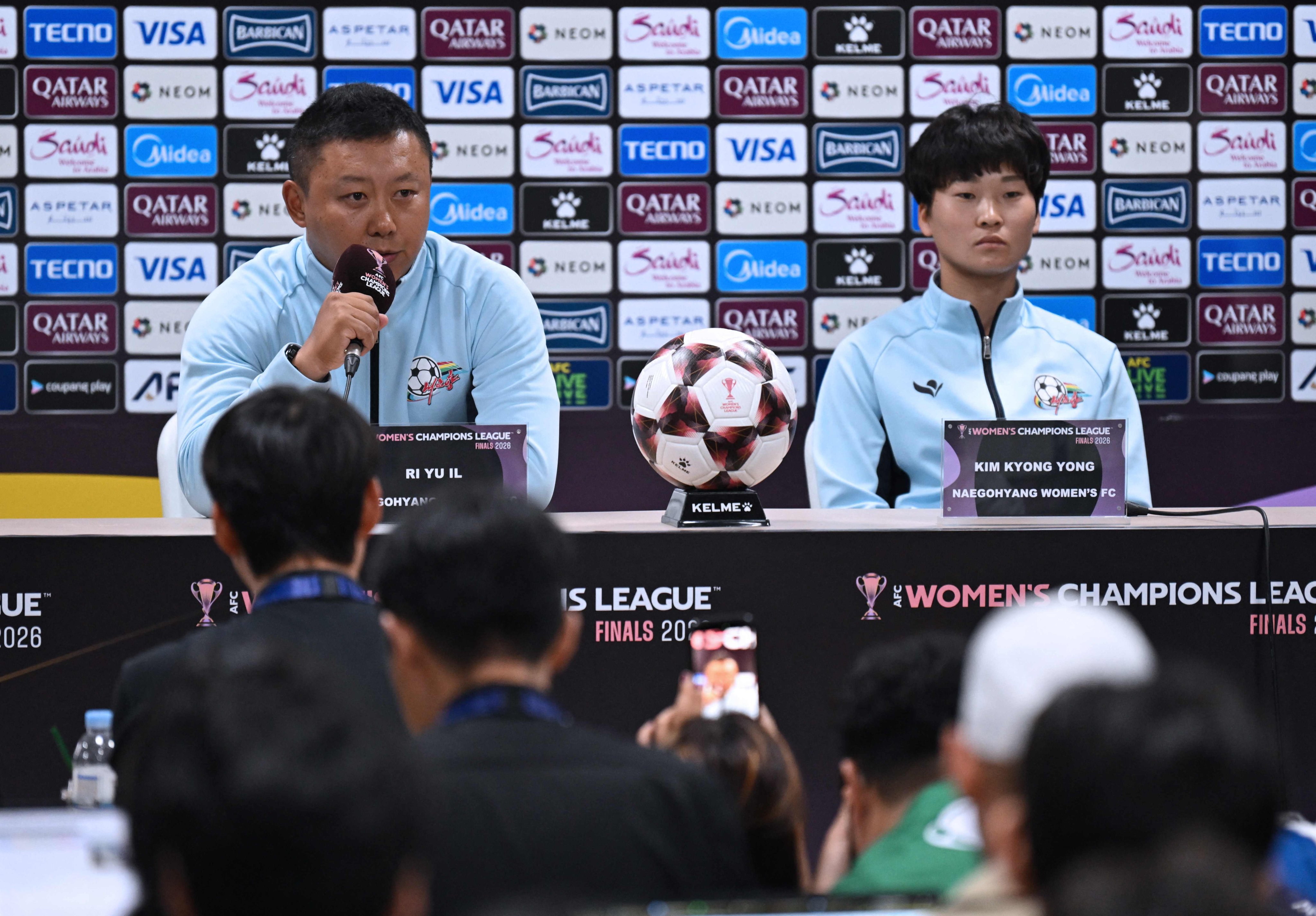 Naegohyang Women’s FC head coach Ri Yu Il (left) and player Kim Kyong Yong answer questions at a press conference at Suwon Sports Complex. Photo: AFP