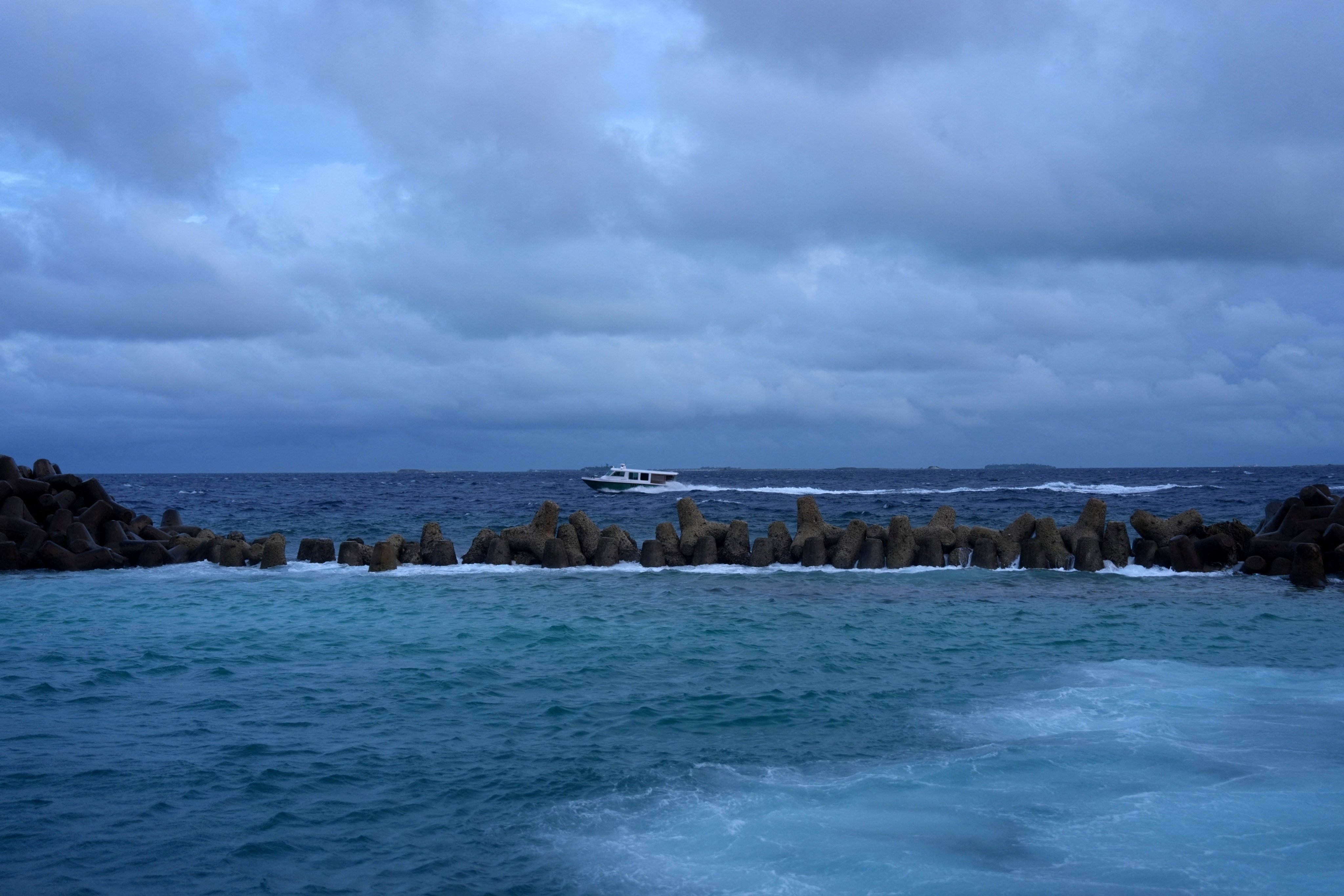 A speedboat moves in the waters of the Indian Ocean on Monday near where a team located the bodies of four Italian scuba divers who died while exploring underwater caves. Photo: Reuters