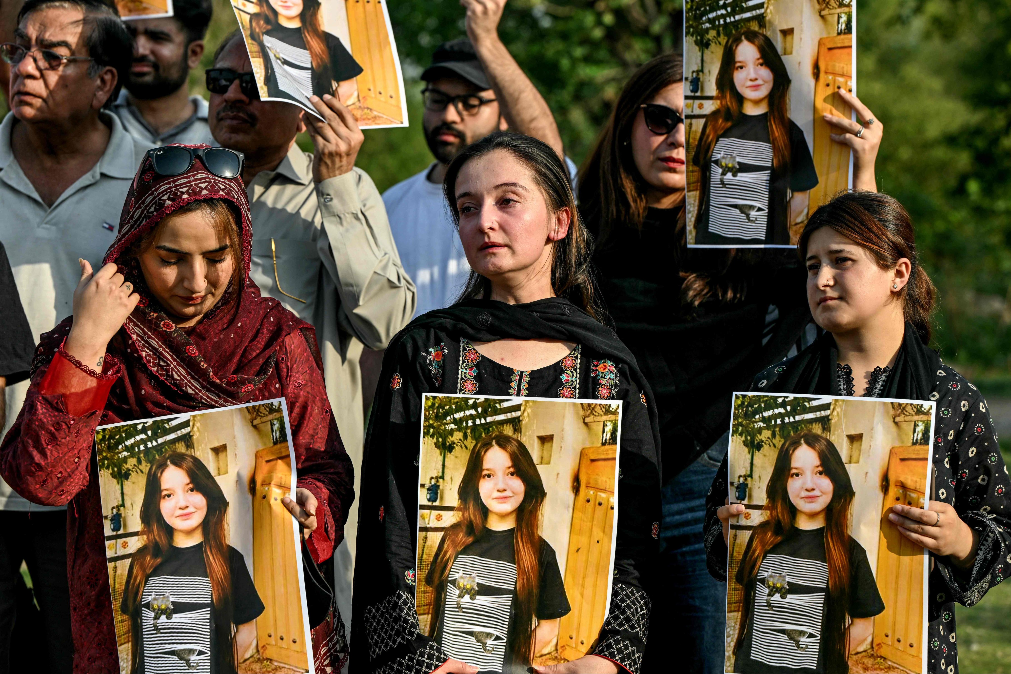Women activists holding photographs of Sana Yousaf take part in a demonstration condemning violence against women in Islamabad on June 5, 2025. Photo: AFP