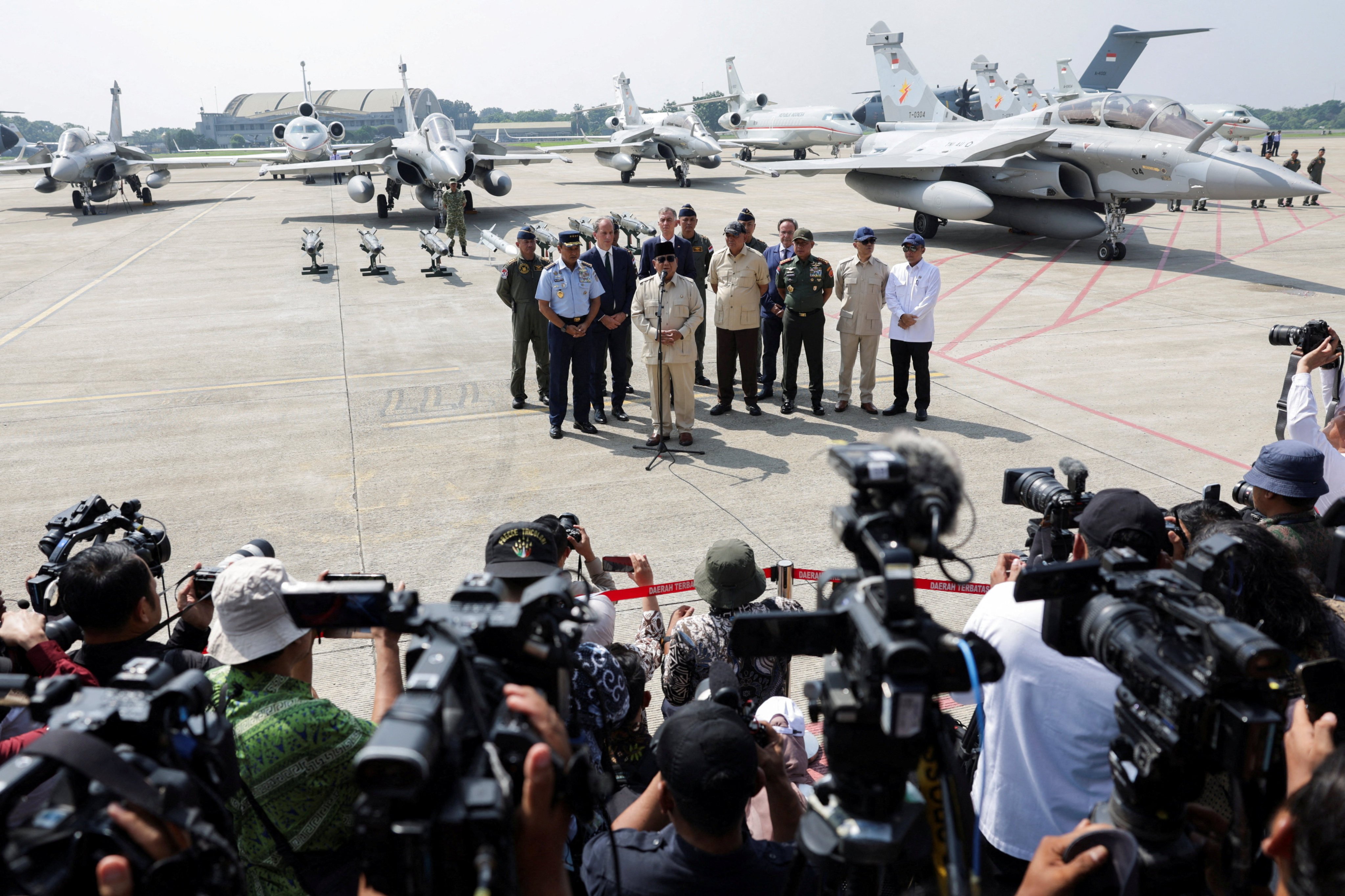Indonesia’s President Prabowo Subianto speaks to members of the media after inaugurating military aircraft at the Halim Perdanakusuma air base in Jakarta on Monday. Photo: Reuters