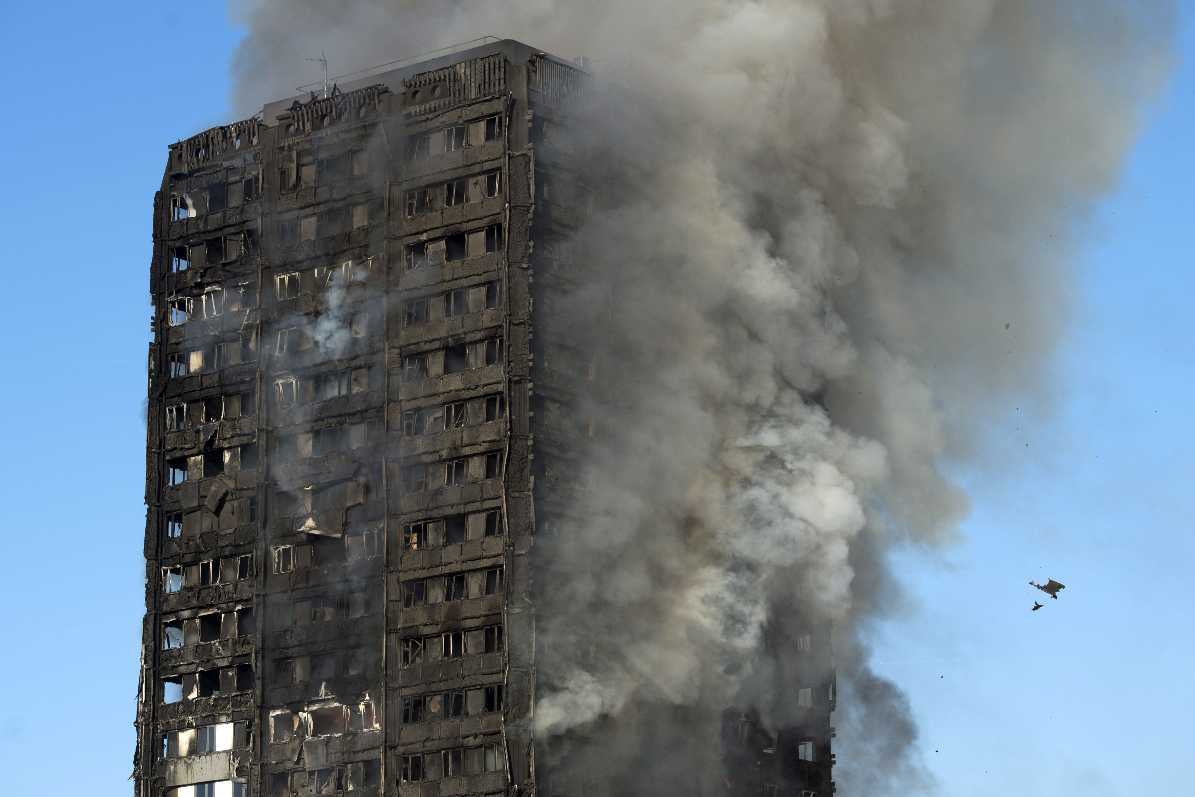 The fire had spread rapidly due to combustible cladding. Photo: EPA
