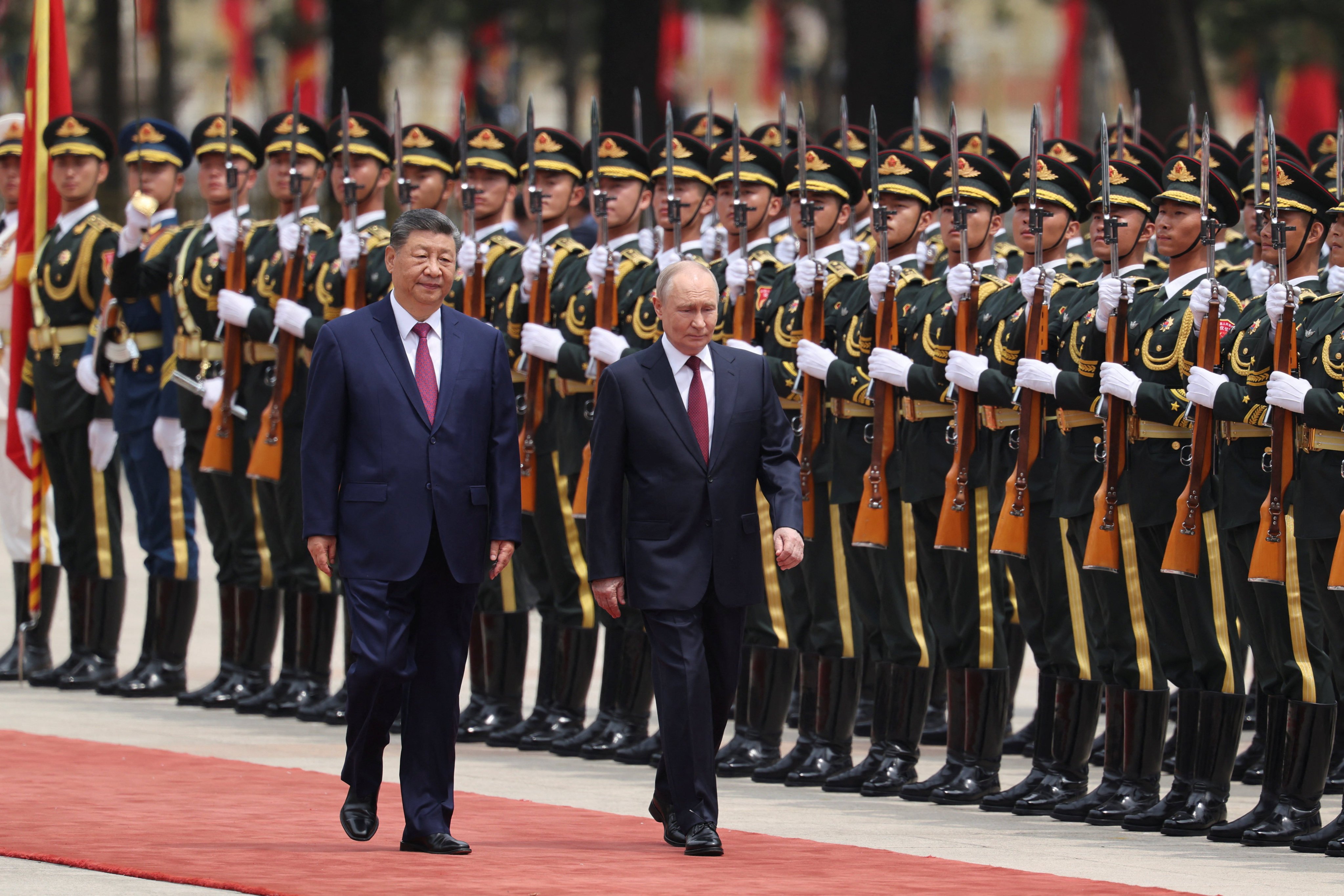 Chinese President Xi Jinping and Russian leader Vladimir Putin inspect an honour guard during a welcome ceremony at the Great Hall of the People in Beijing on Wednesday. Photo: Reuters