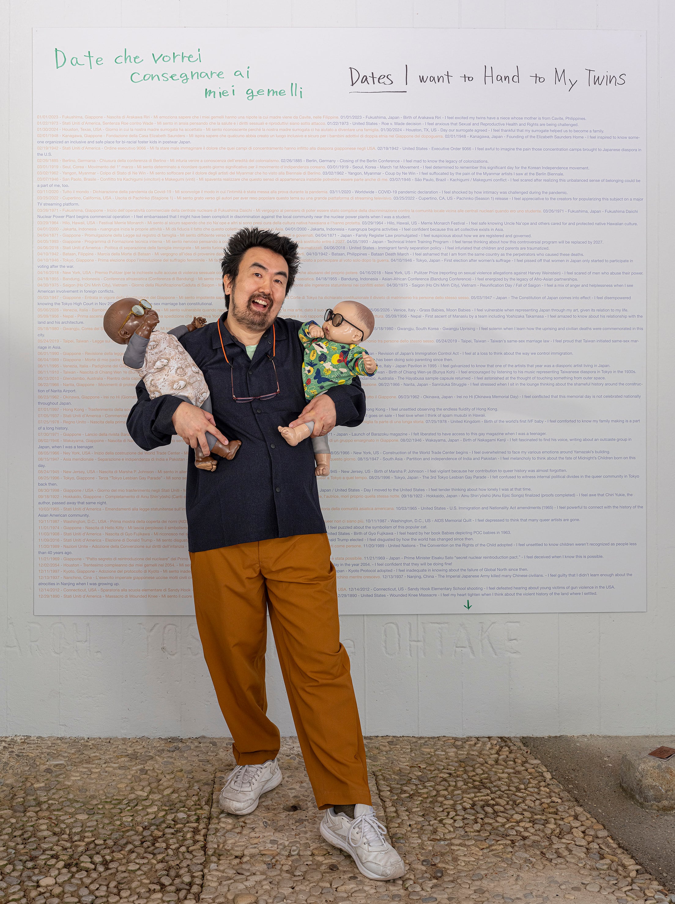 Japanese-American artist Ei Arakawa-Nash holds two of the 208 baby dolls that are part of their exhibition “Grass Babies, Moon Babies” at the 2026 Venice Biennale’s Japan Pavilion. Photo: Uli Holz