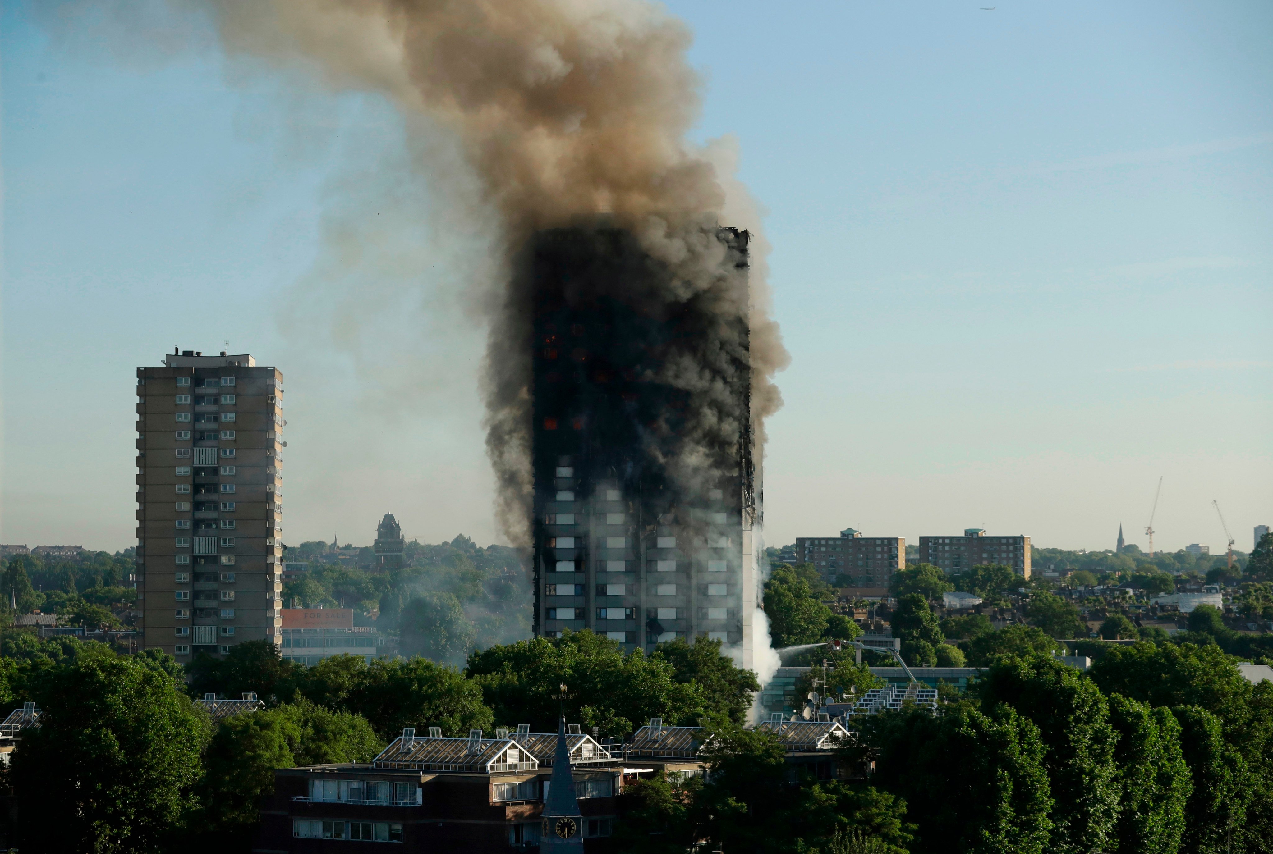 The tower in flames in 2017. The block was home to hundreds of residents. Photo: AP