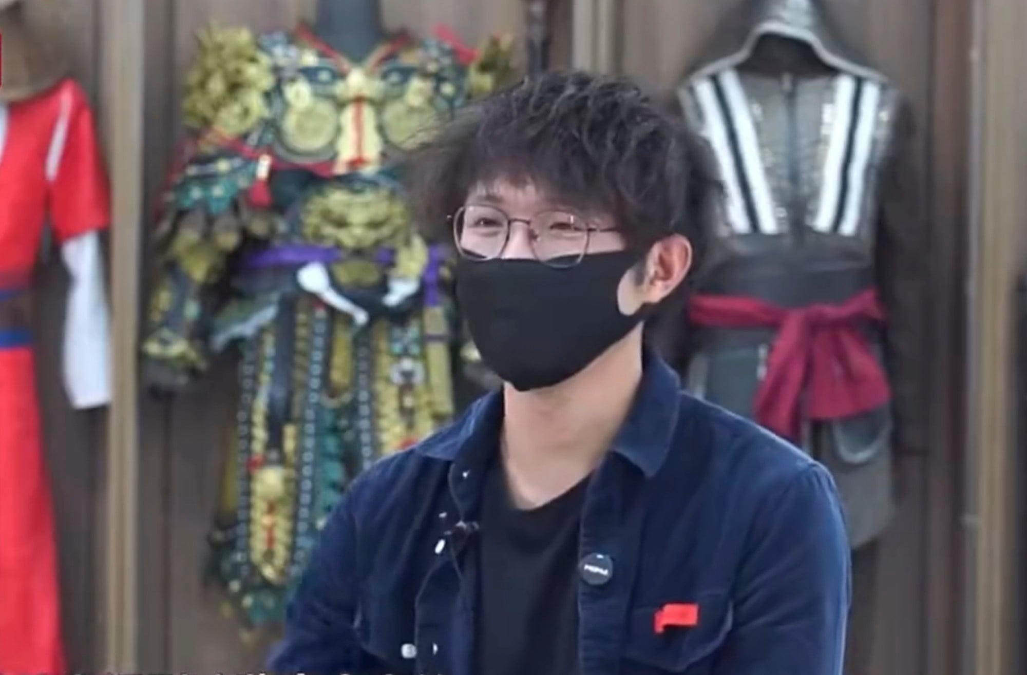 Fan, above, being interviewed by the media about his fantasy novel inspired creation. Photo: Sina