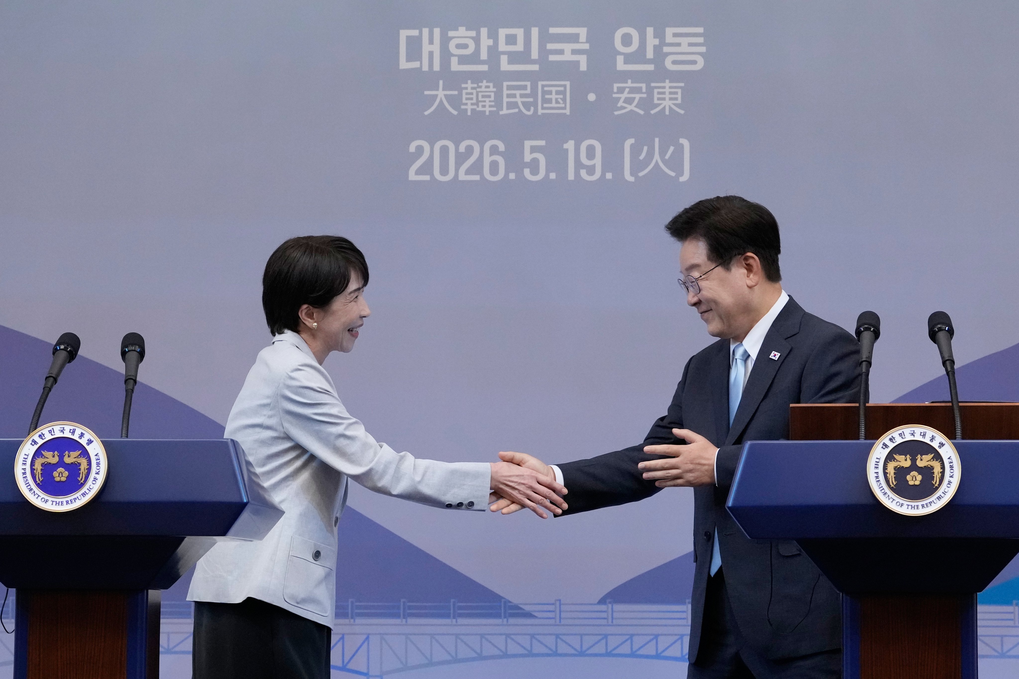 Japanese Prime Minister Sanae Takaichi shakes hands with South Korean President Lee Jae Myung during a joint news conference in Andong, South Korea, on Tuesday. Photo: EPA