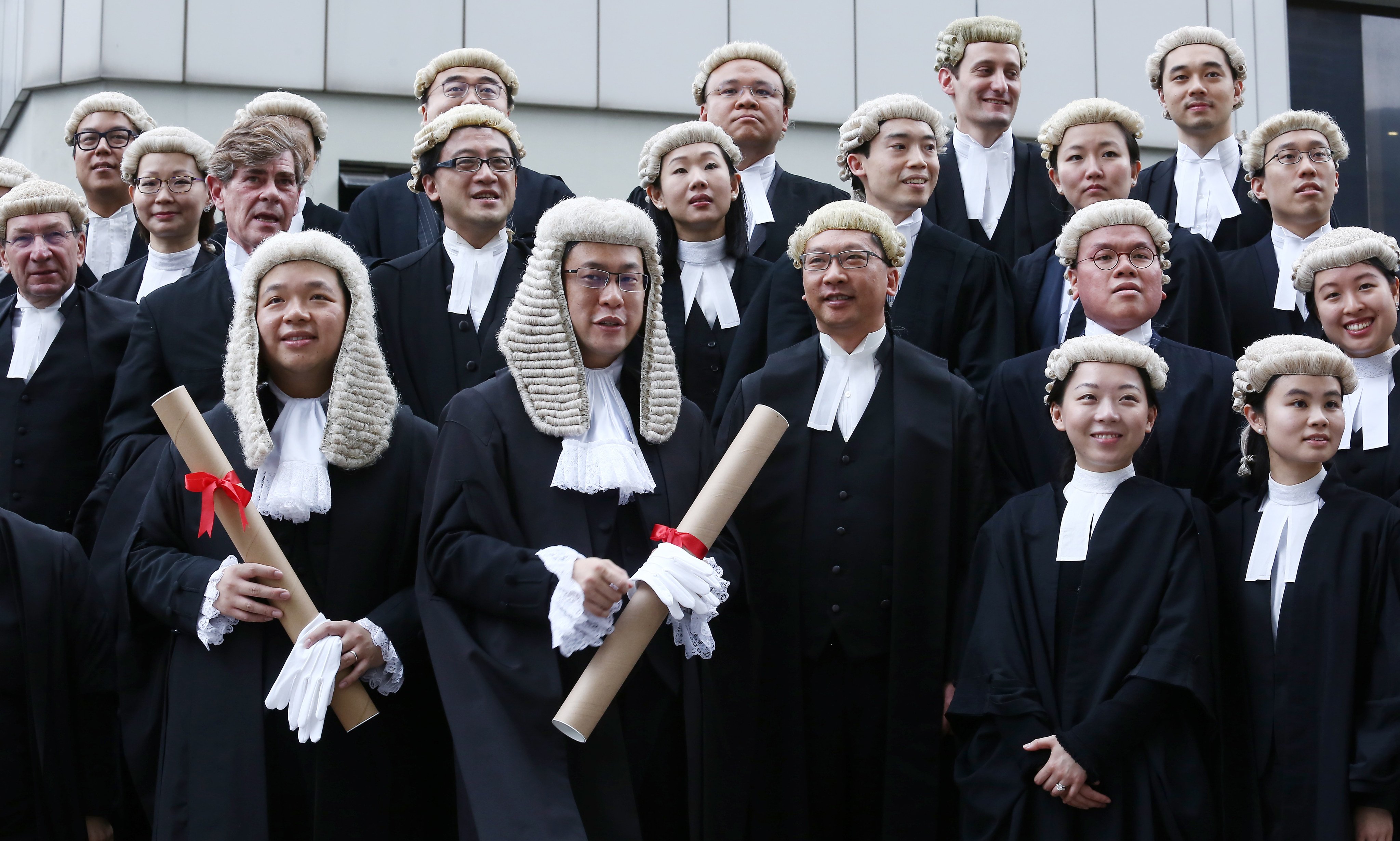 (Front row left to right) Bernard Man, Victor Dawes, Secretary for Justice Rimsky Yuen and other guests attend the ceremony for the admission of the new senior counsel. Photo: Jonathan Wong