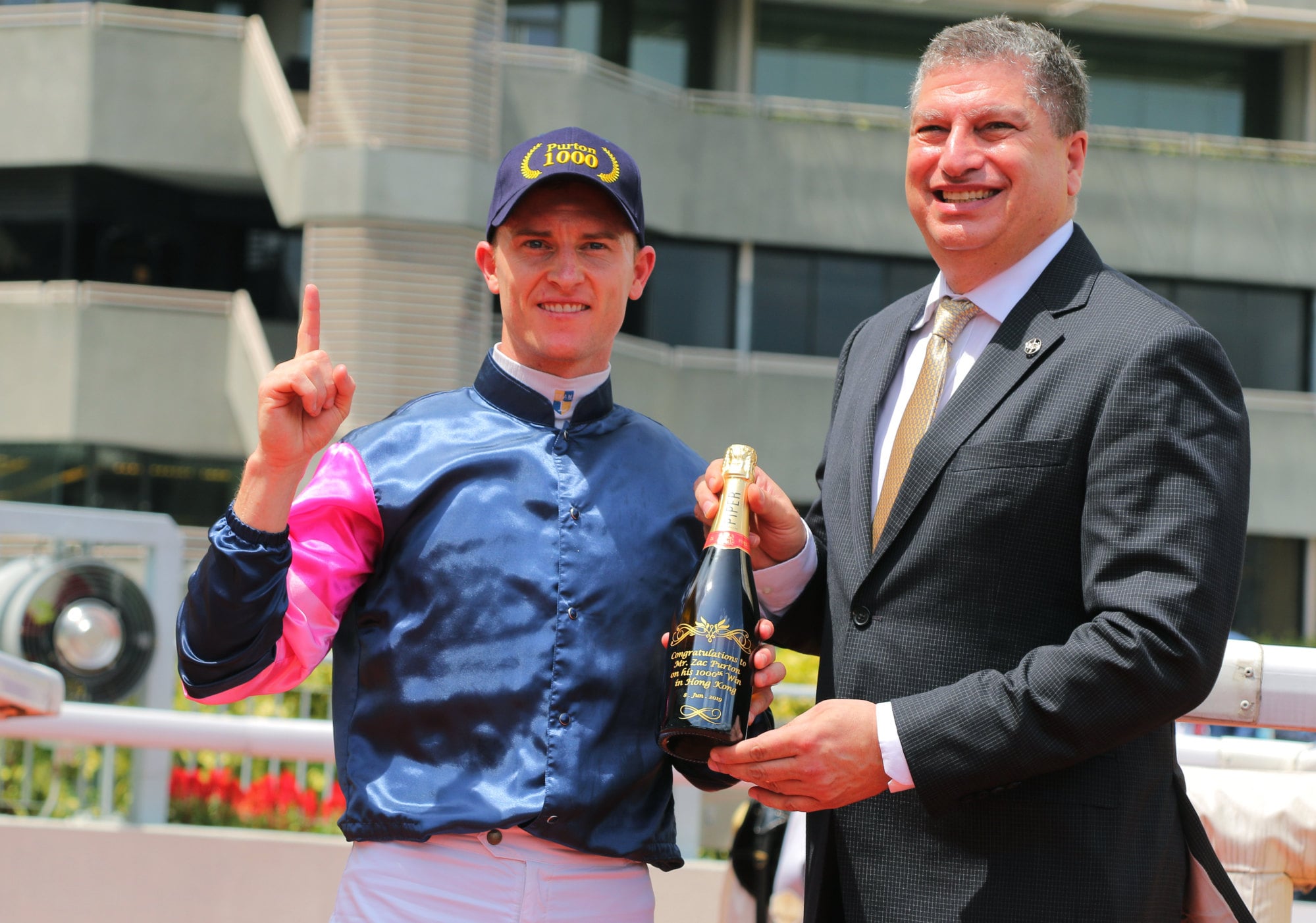 Zac Purton celebrates his 1,000th Hong Kong victory.