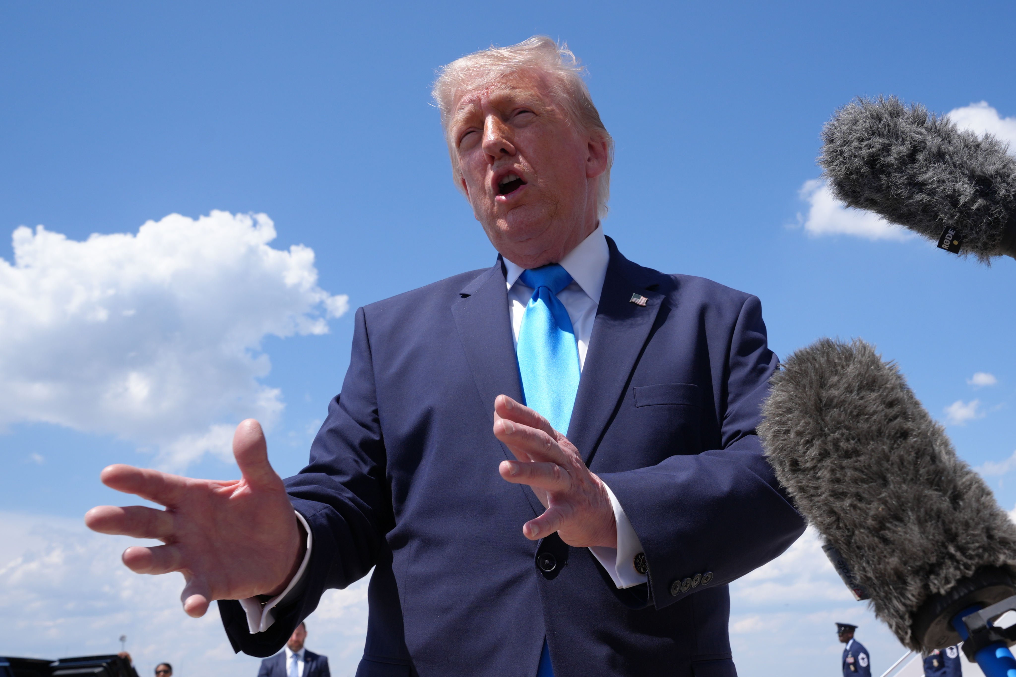 US President Donald Trump speaks to the press after stepping off Air Force One, at Joint Base Andrews, Maryland, on Wednesday. Photo: AP