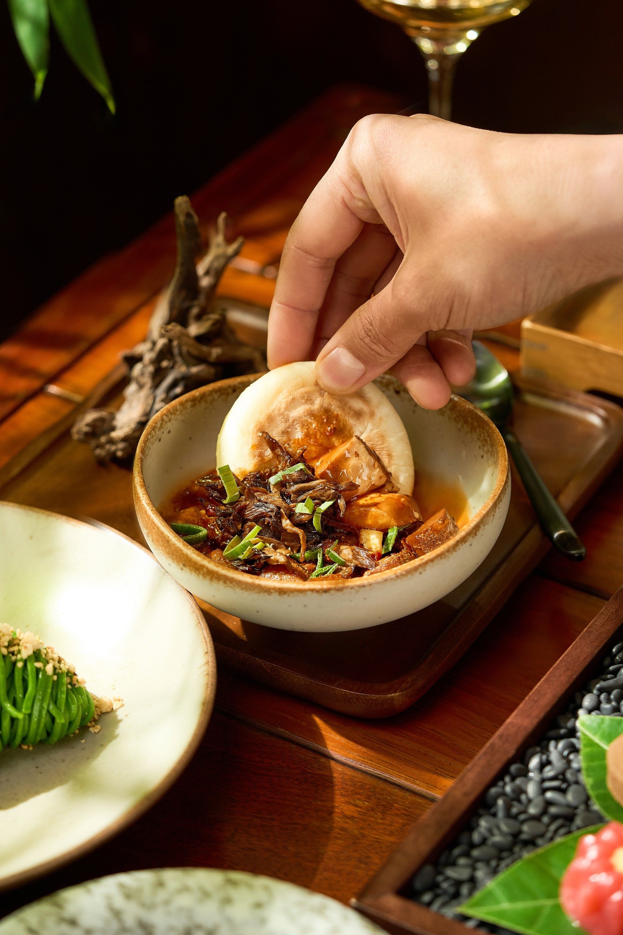 Wild mushroom tofu with guokui, or crispy flatbread, at Mi Xun Teahouse. Photo: Mi Xun Teahouse