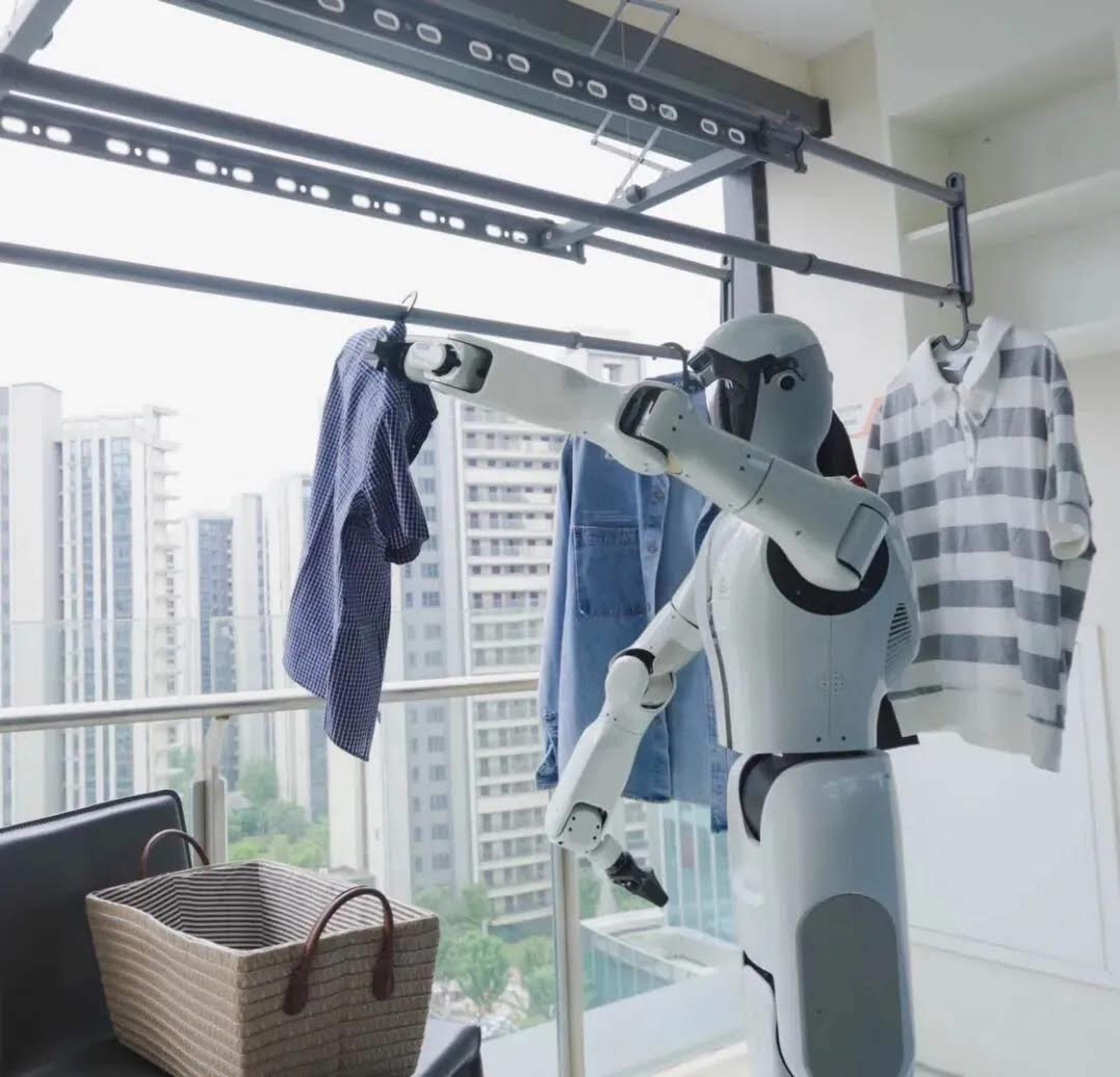 A humanoid robot, the SeeLight S1, performs a household chore. Photo: Changjiang Daily