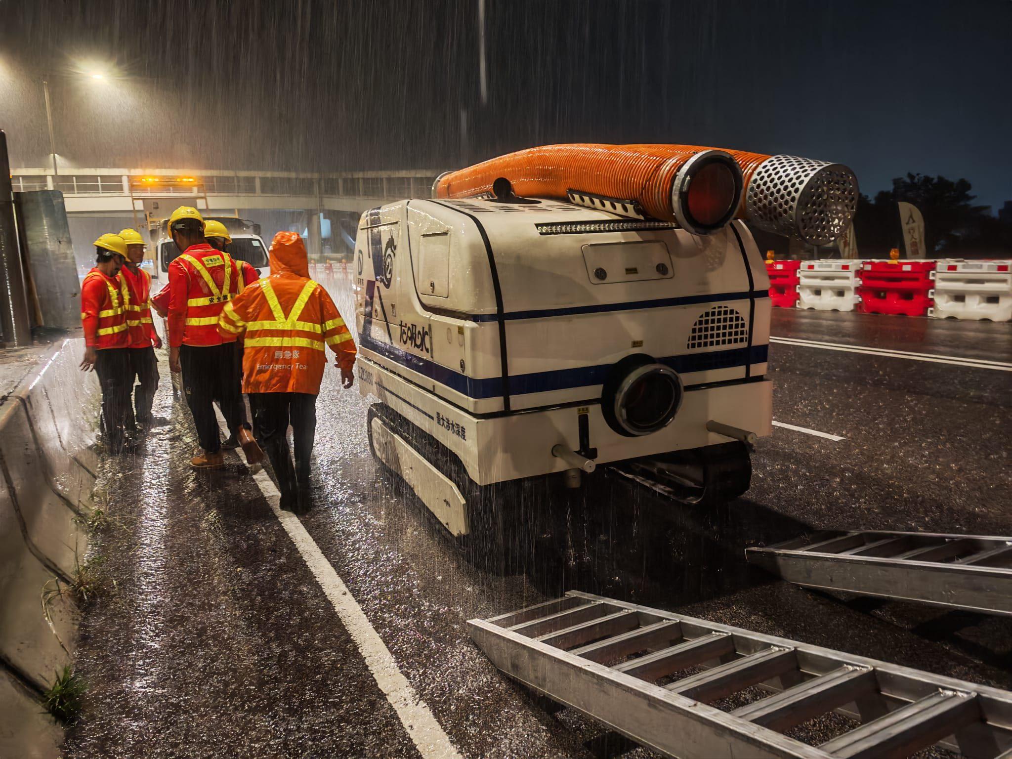 Hong Kong emergency crews worked around the clock with robotic “water-pumping dragons” to clear widespread flooding. Photo: Handout