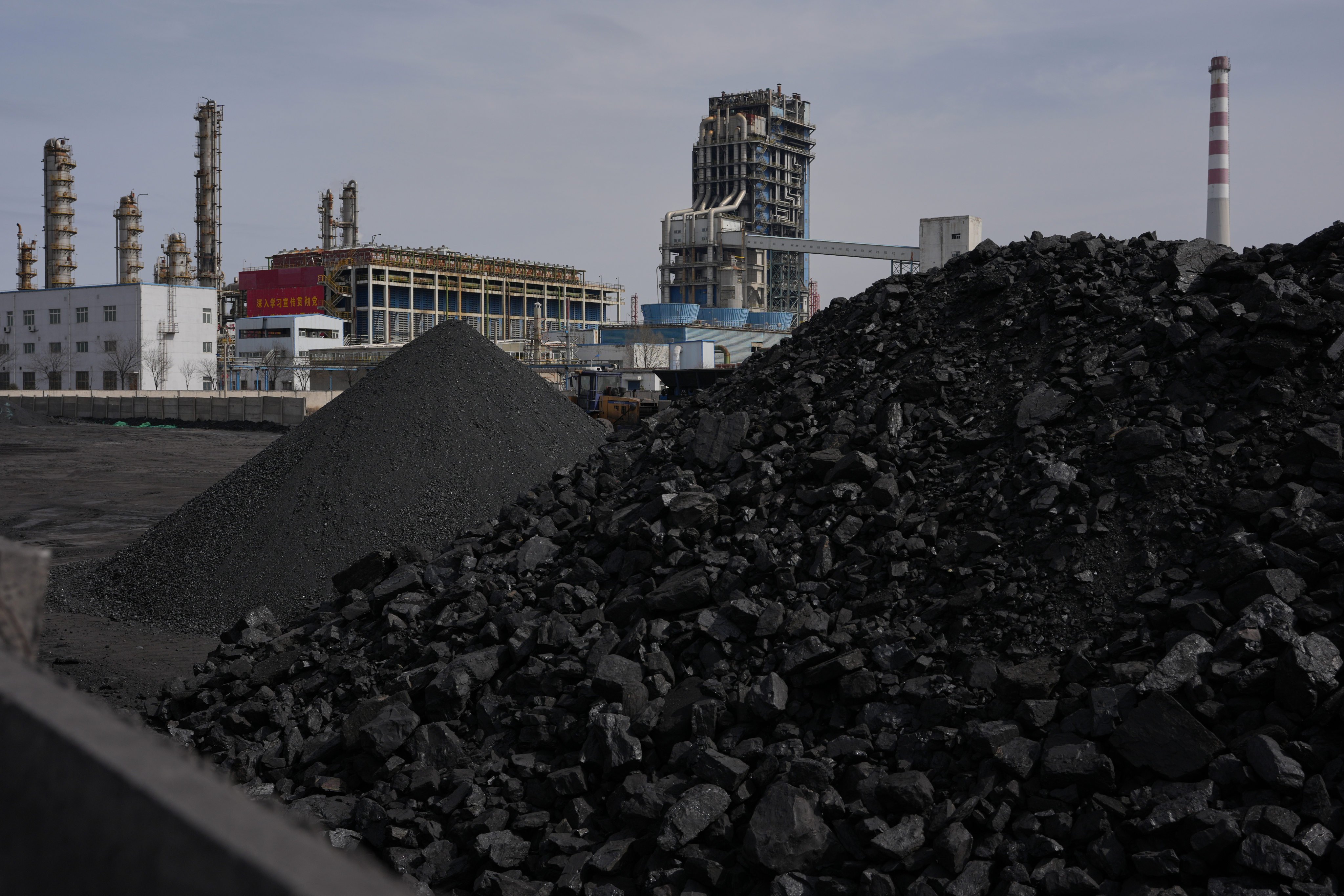 Amid a global energy shortage, coal piles sit near a chemical plant in Datong, as China turns coal into critical metals. Photo: AP