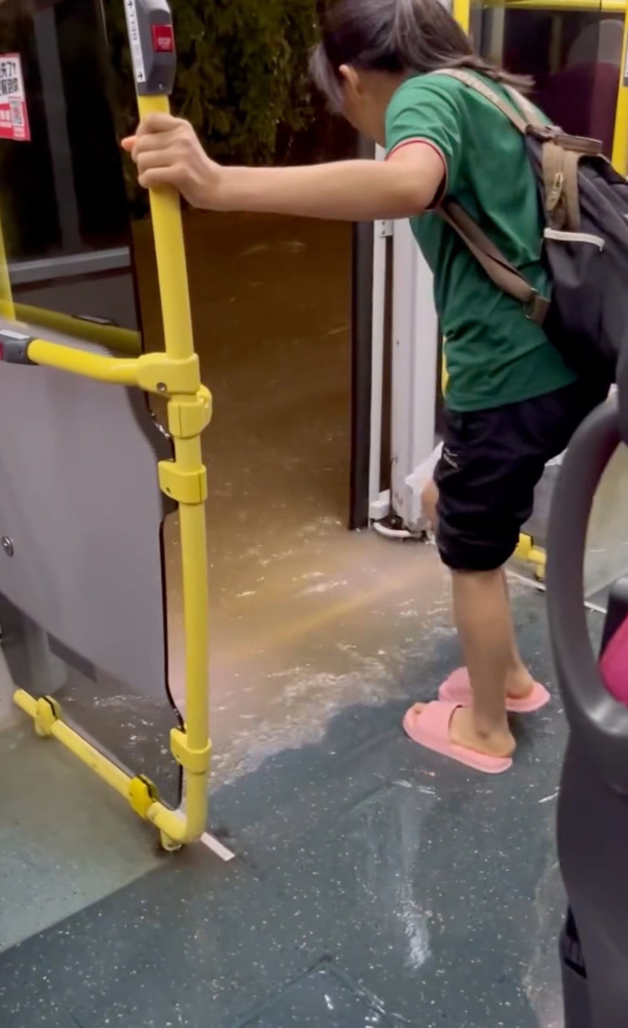 A still from a video clip posted online shows water levels reaching the lower deck of a bus. Photo: Handout