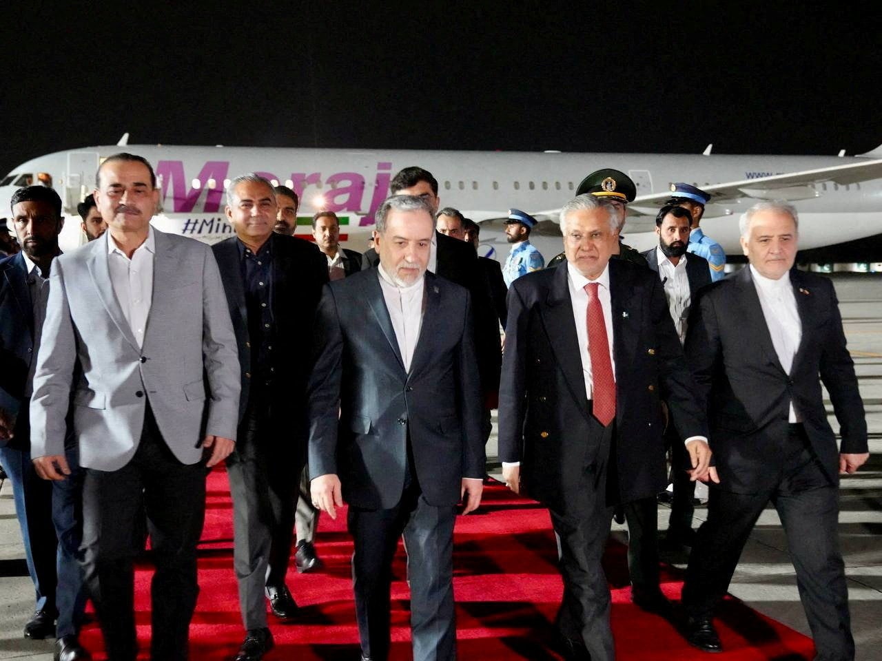 Pakistan’s Foreign Minister Mohammad Ishaq Dar and army chief, Field Marshal Asim Munir, welcome Iranian Foreign Minister Abbas Araqchi upon his arrival in Rawalpindi, Pakistan, in April. Pool photo: Handout via Reuters