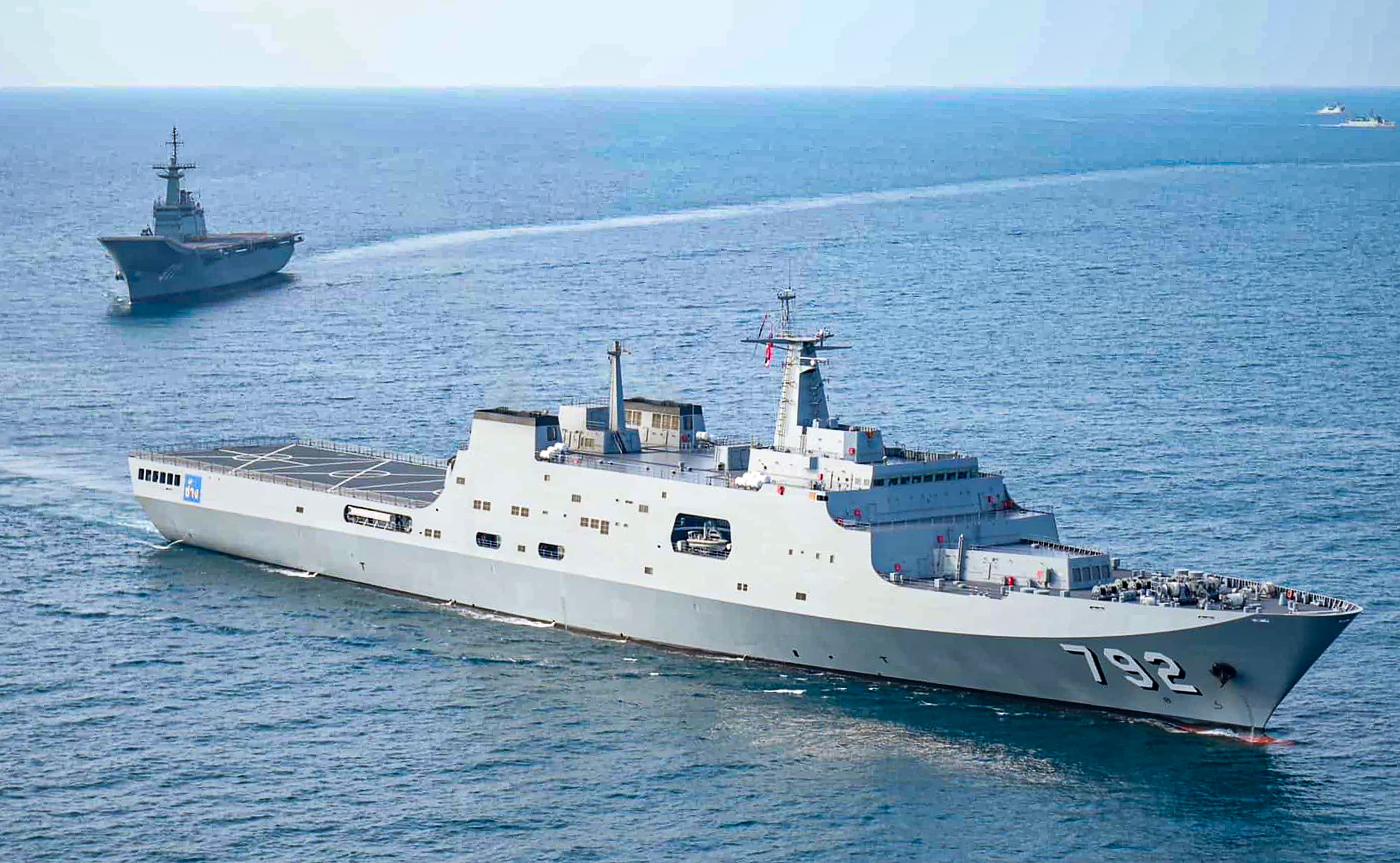 Thai aircraft carrier HTMS Chakri Naruebet (rear) accompanies transport ship HTMS Chang (front) before entering a naval base. Photo: Royal Thai Navy