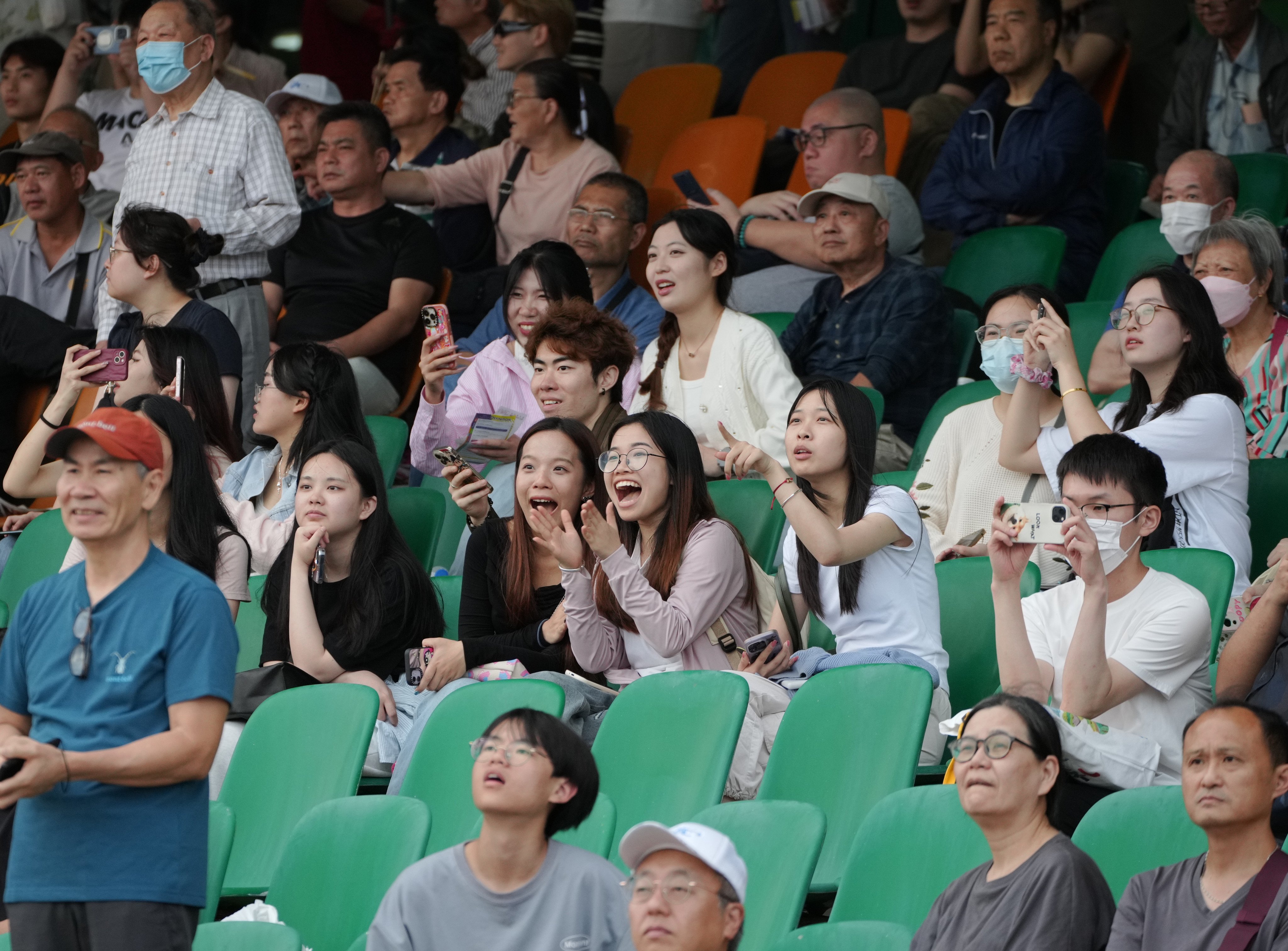 Bettors react to the race results on the last horse racing day at the Macau Jockey Club. Photo: Eugene Lee