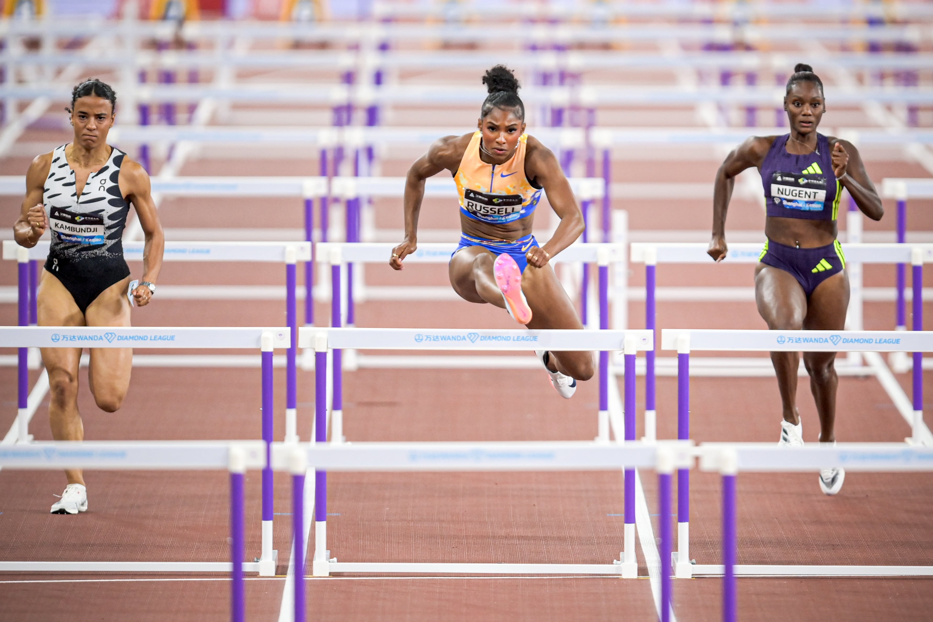 Masai Russell (centre), here competing in Zhejiang Province in May, is hoping to break the 100m hurdles world record in Saturday’s Xiamen Diamond League event. Photo: Xinhua