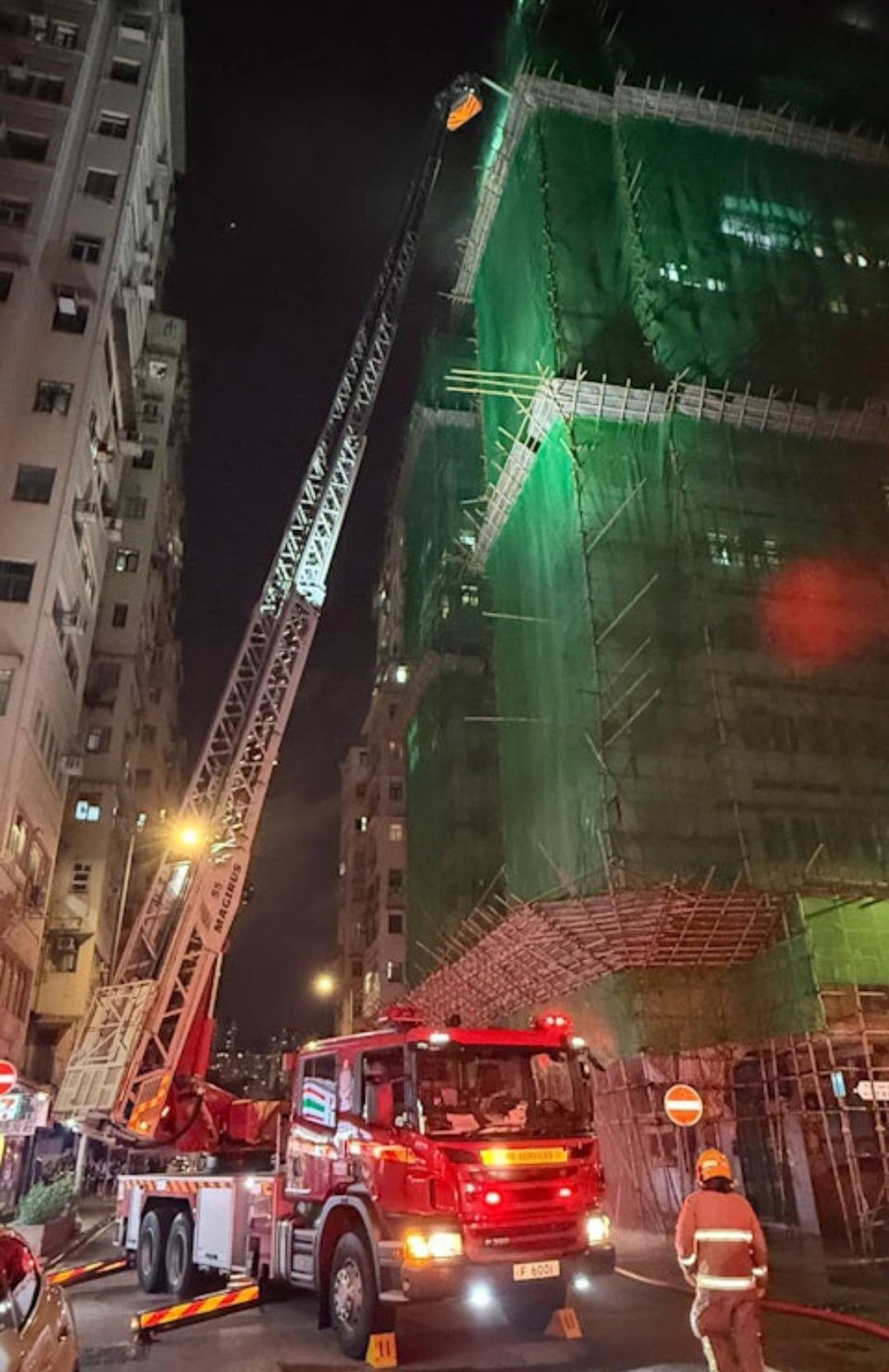 Firefighters tackle the late-night blaze at Man Yuen Building in Jordan. Photo: Handout Firefighters tackle the late-night blaze at Man Yuen Building in Jordan. Photo: Handout