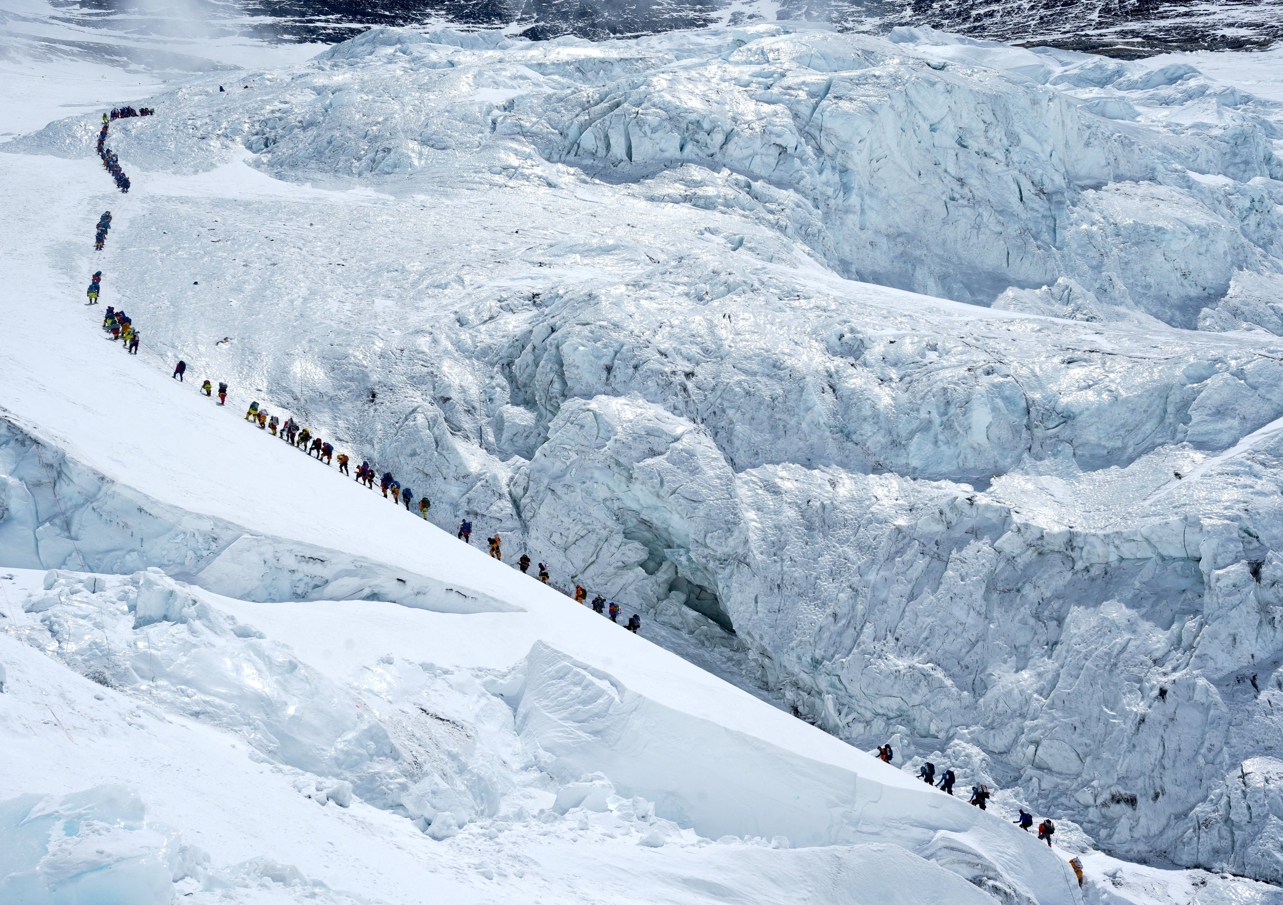 Climbers walk in a long queue as they head to summit Mount Everest in the Solukhumbu district of Nepal. Photo: Reuters