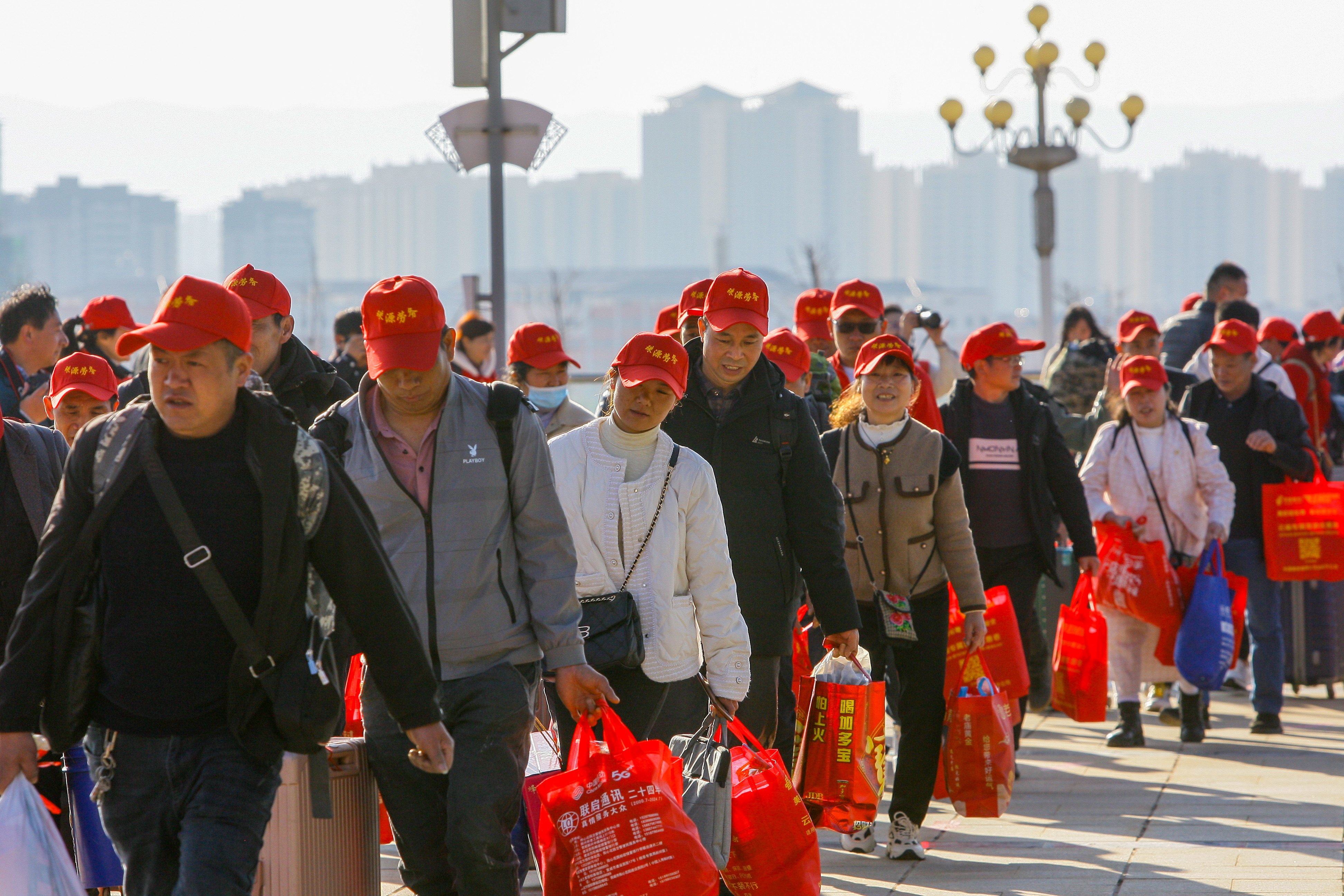 Migrant workers in Yunnan province head to a railway station during Chinese New Year in February 2024. Photo: VCG via Getty Images