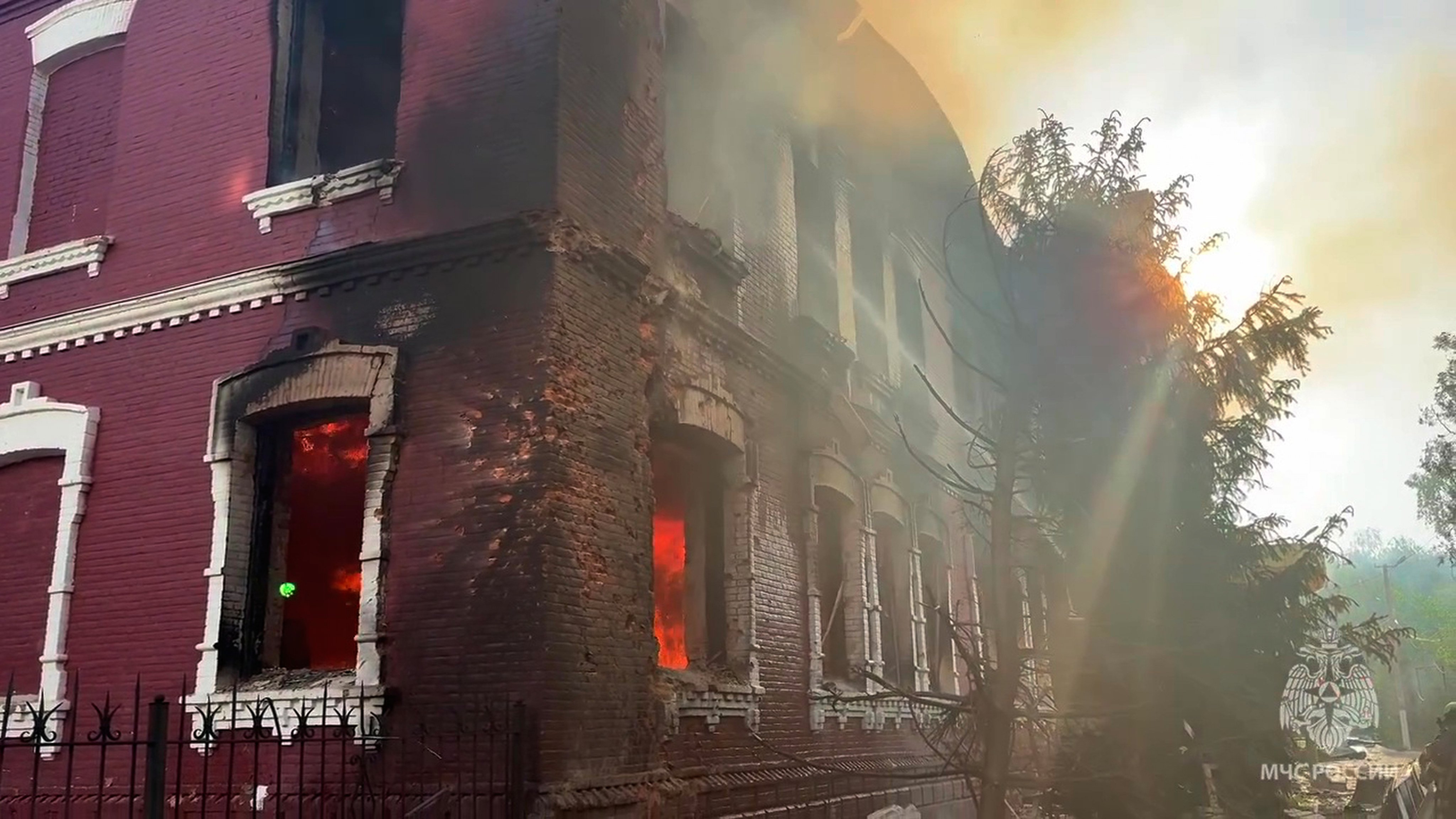 Flames and smoke rise from the side of a college building in Starobilsk, Ukraine. Photo: Russian Emergency Ministry Press Service via AP
