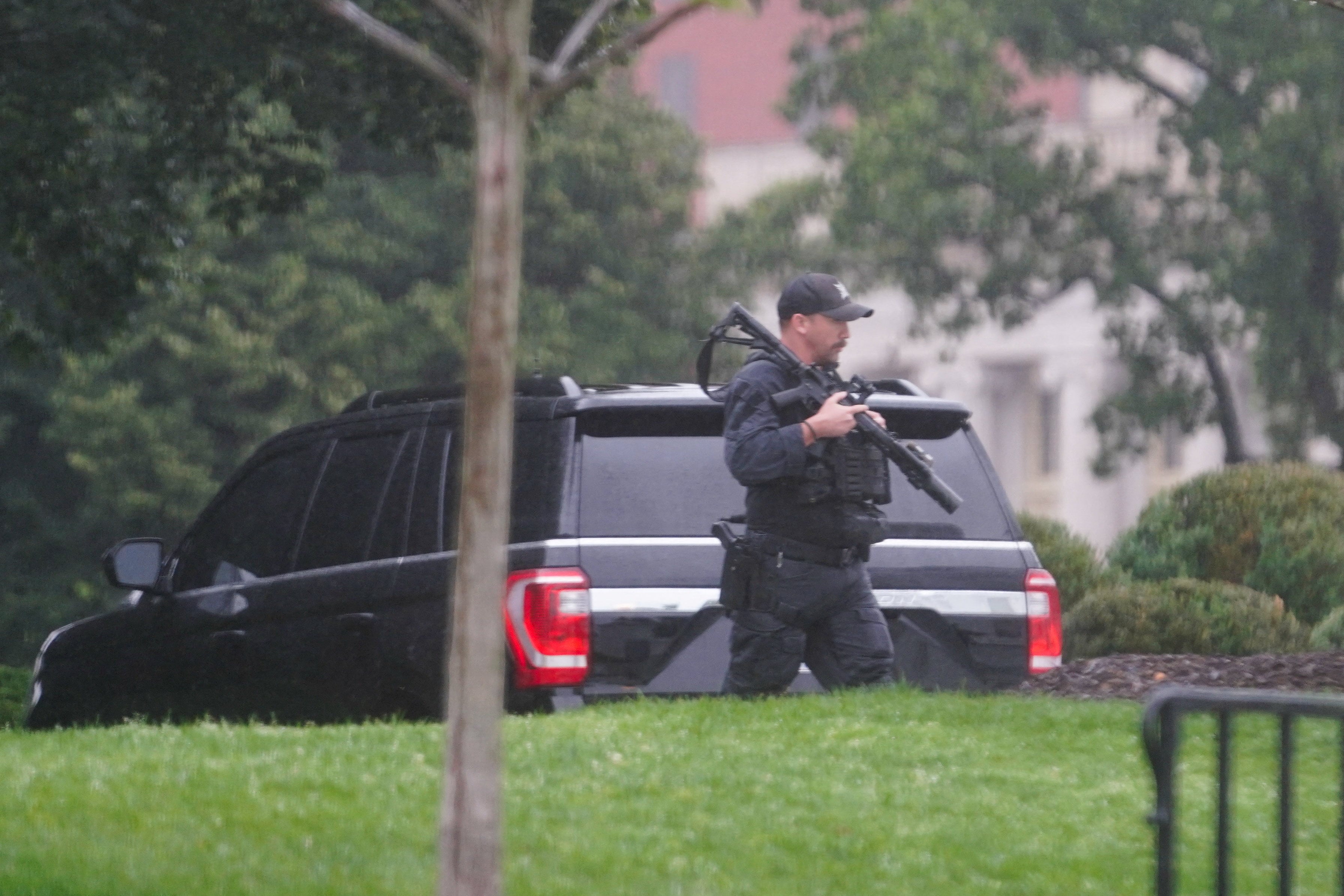 An armed US Secret Service agent is seen at the White House on Saturday after shots were heard nearby. Photo: Reuters