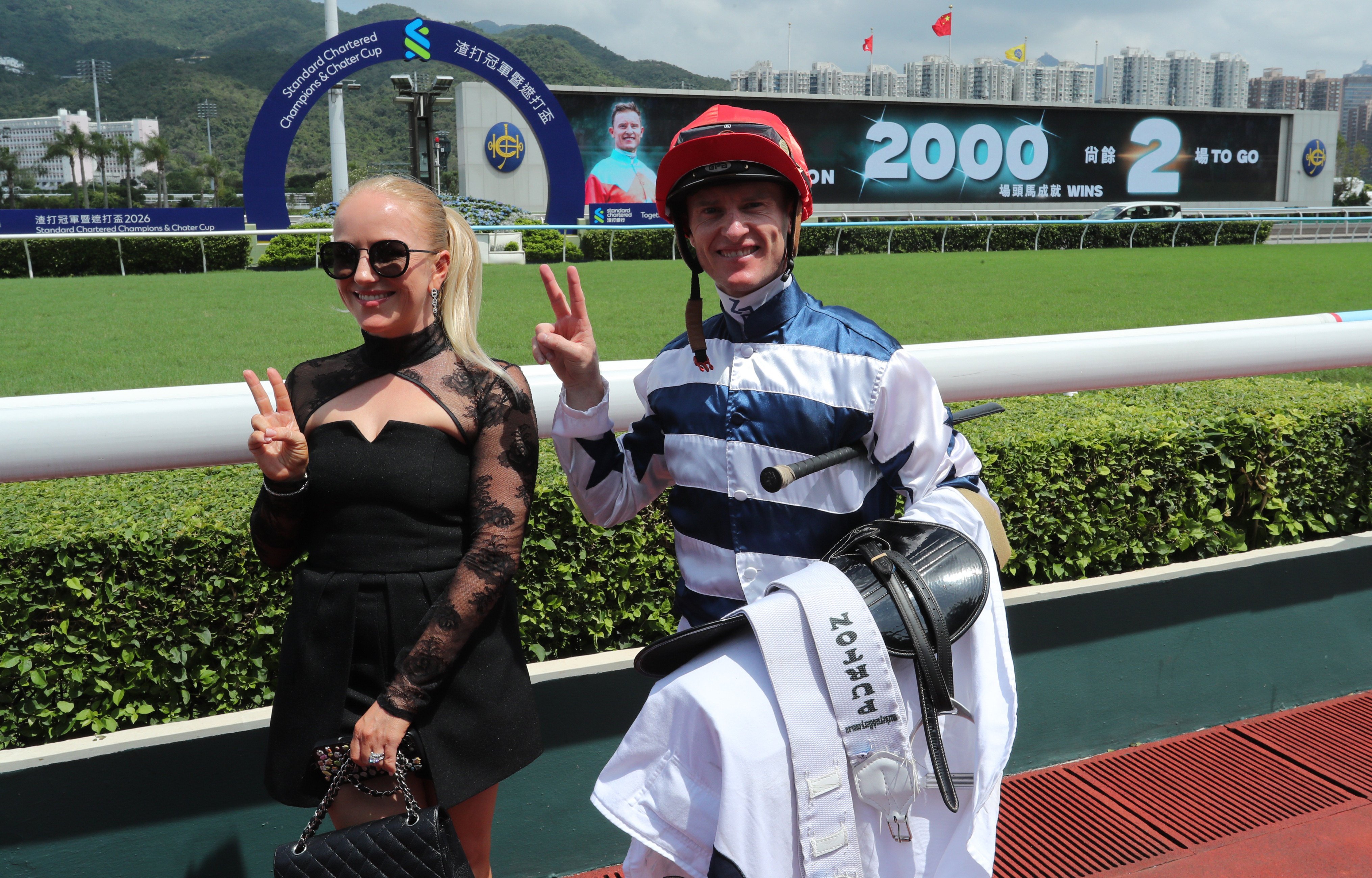 Zac Purton and wife Nicole celebrate his 1,998th Hong Kong winner. Photos: Kenneth Chan