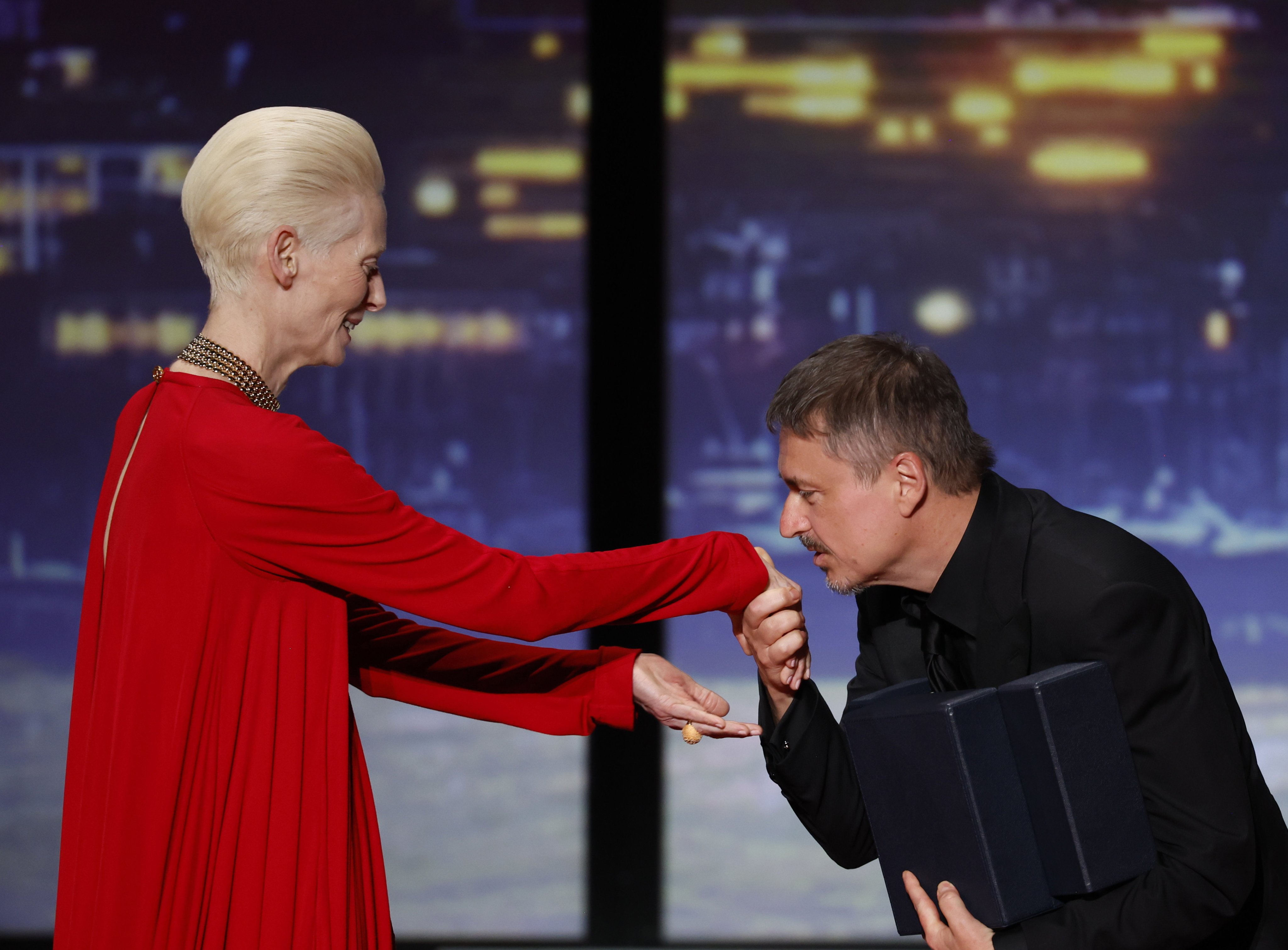 Director Cristian Mungiu receives the Palme d’Or award for ‘Fjord’ from Tilda Swinton at the 79th annual Cannes Film Festival on Saturday. Photo: EPA