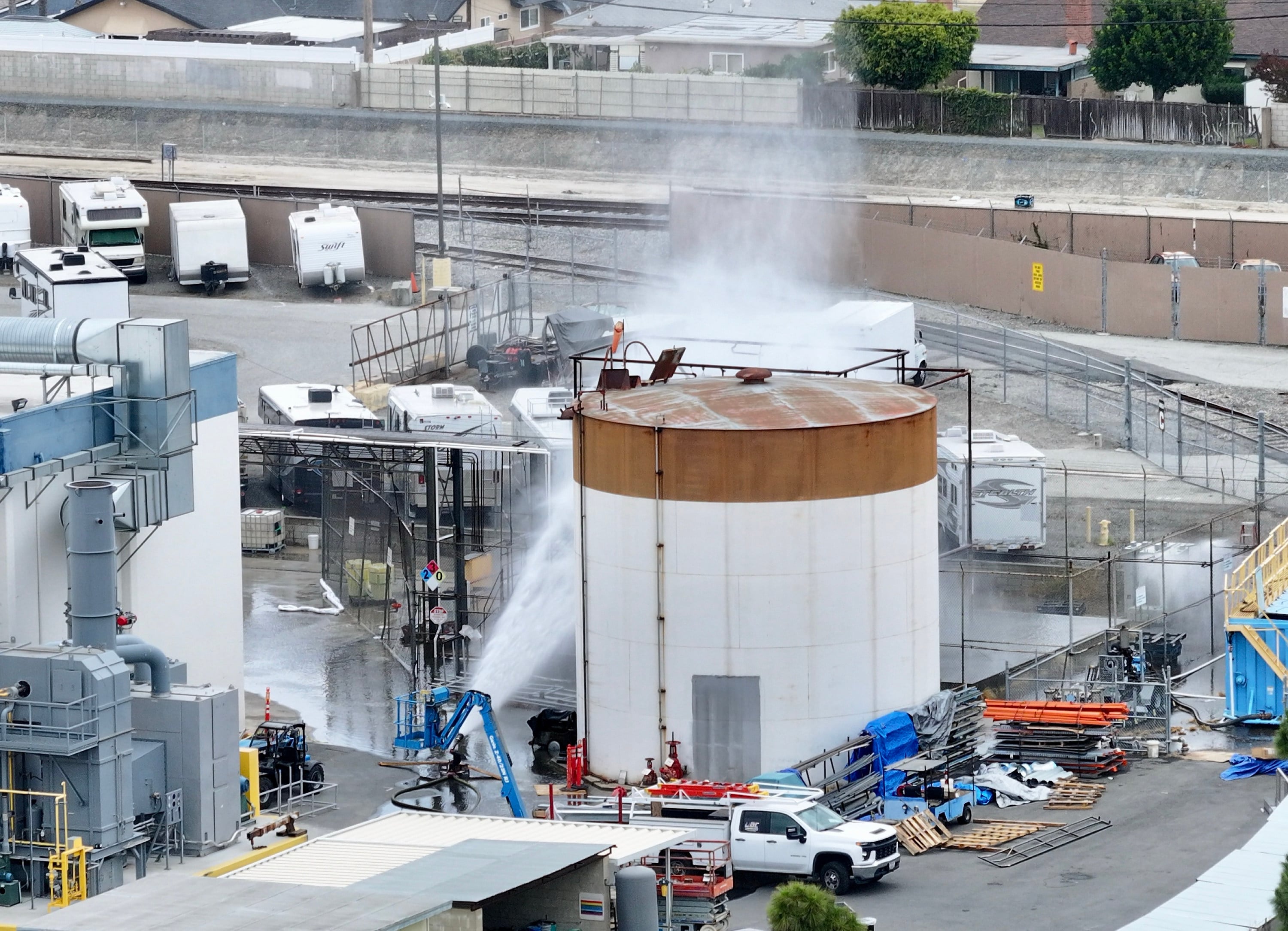 Water is sprayed on a tank that overheated at GKN Aerospace in Garden Grove, California on Friday. On Sunday, officials said a possible crack may help prevent an explosion. Photo: Orange County Register / TNS
