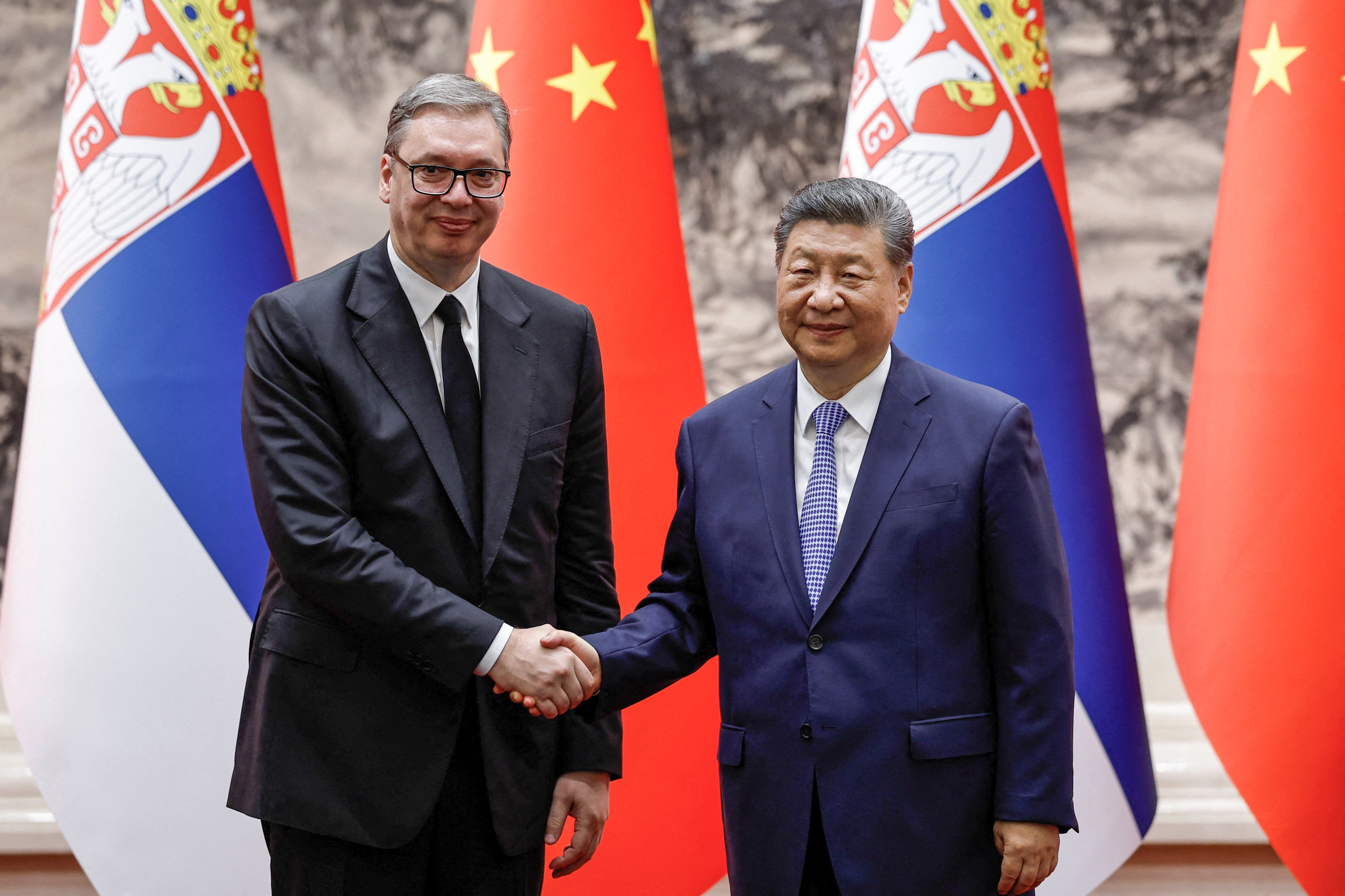 Chinese President Xi Jinping (right) and Serbian President Aleksandar Vucic (left) shake hands after a signing ceremony in Beijing, China on May 25, 2026. Photo: Reuters