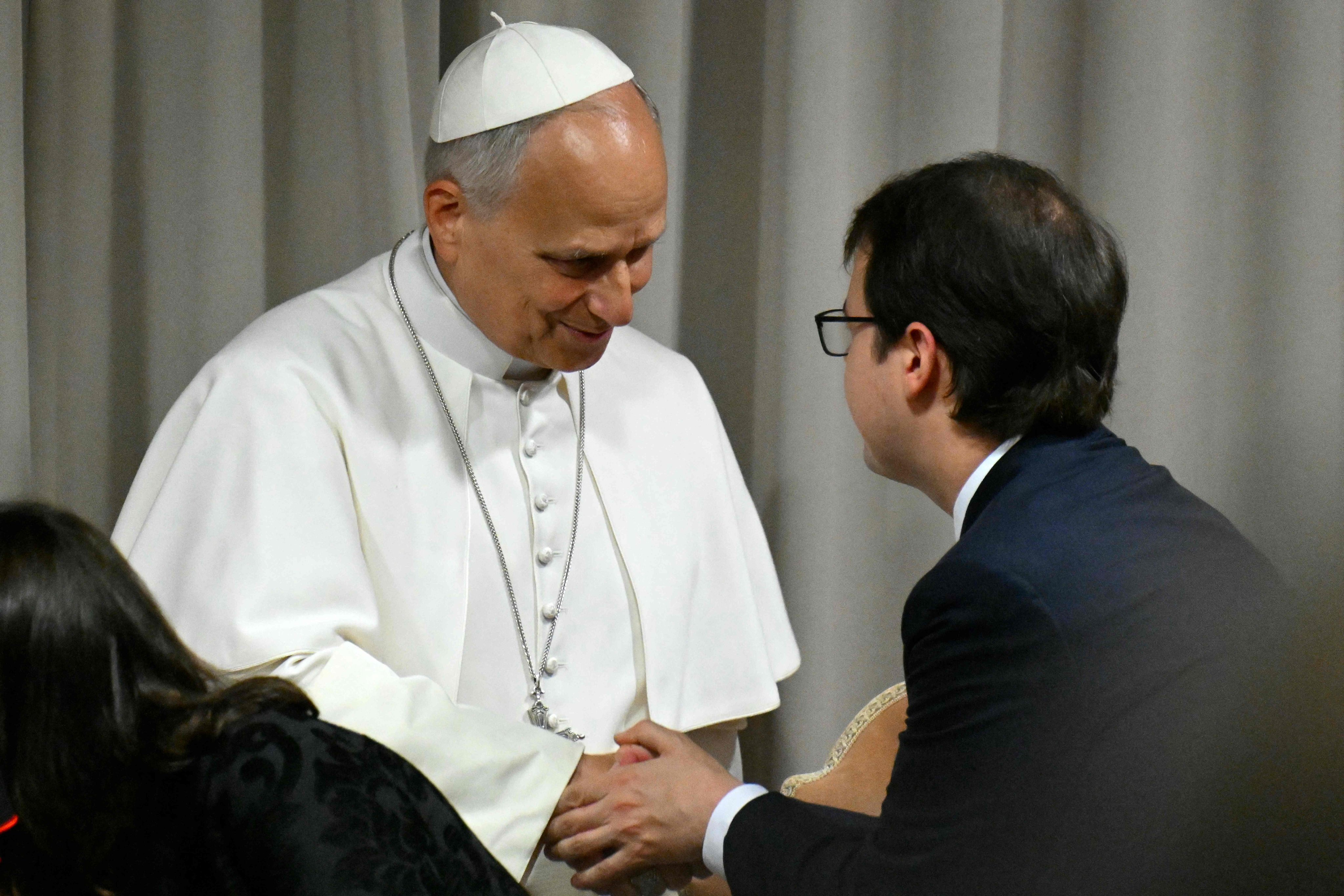 Co-founder of US artificial intelligence (AI) company Anthropic, Christopher Olah, shakes hands with Pope Leo XIV before the presentation of the first Encyclical Letter ‘Magnifica Humanitas’, focused on the rise of artificial intelligence, in The Vatican on Monday. Photo: AFP