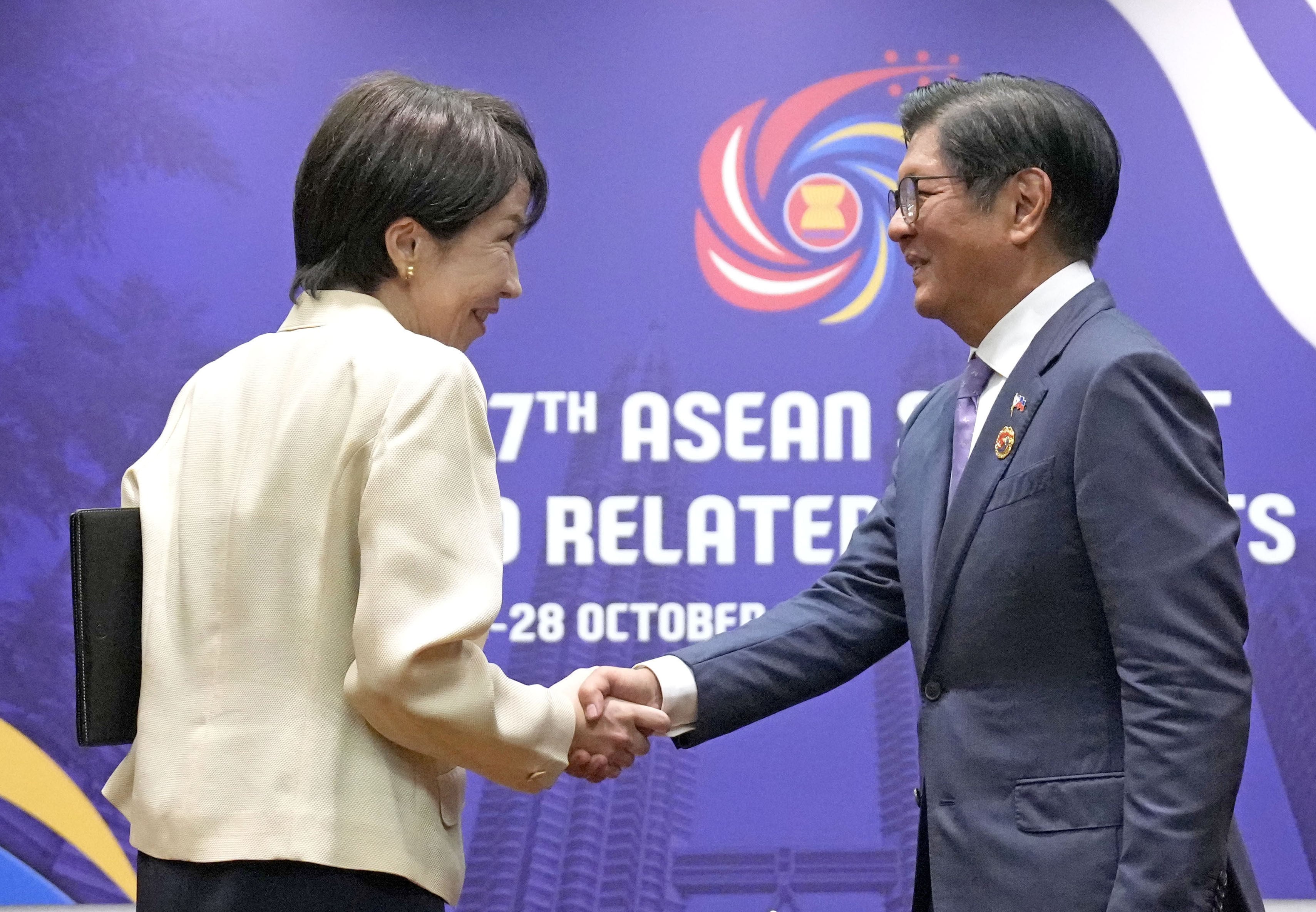 Japanese Prime Minister Sanae Takaichi (left) shakes hands with Philippine President Ferdinand Marcos Jnr ahead of their talks in Kuala Lumpur in October last year. Photo: Kyodo
