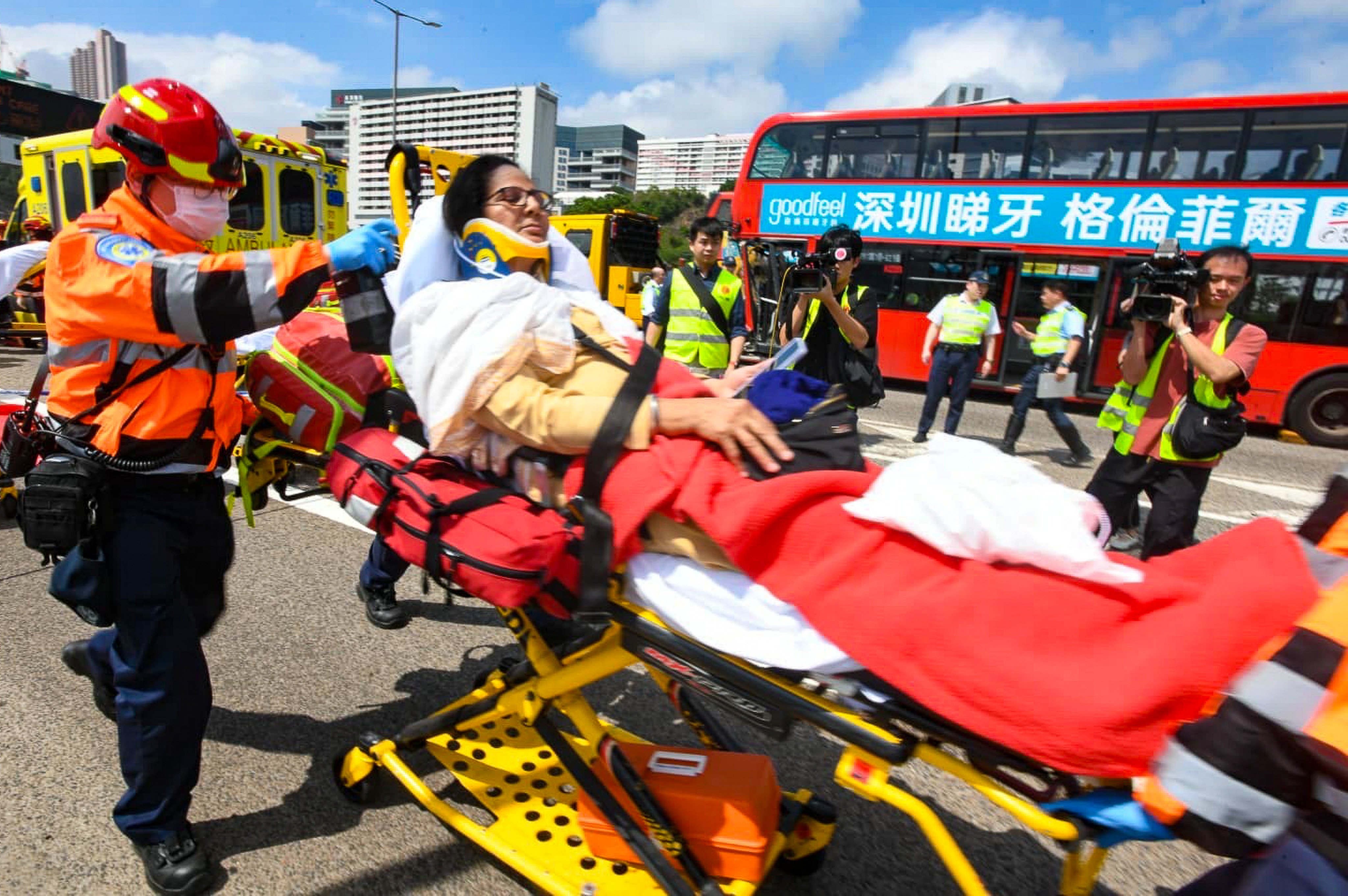 An injured passenger is transported to an ambulance on a trolley. Photo: Handout