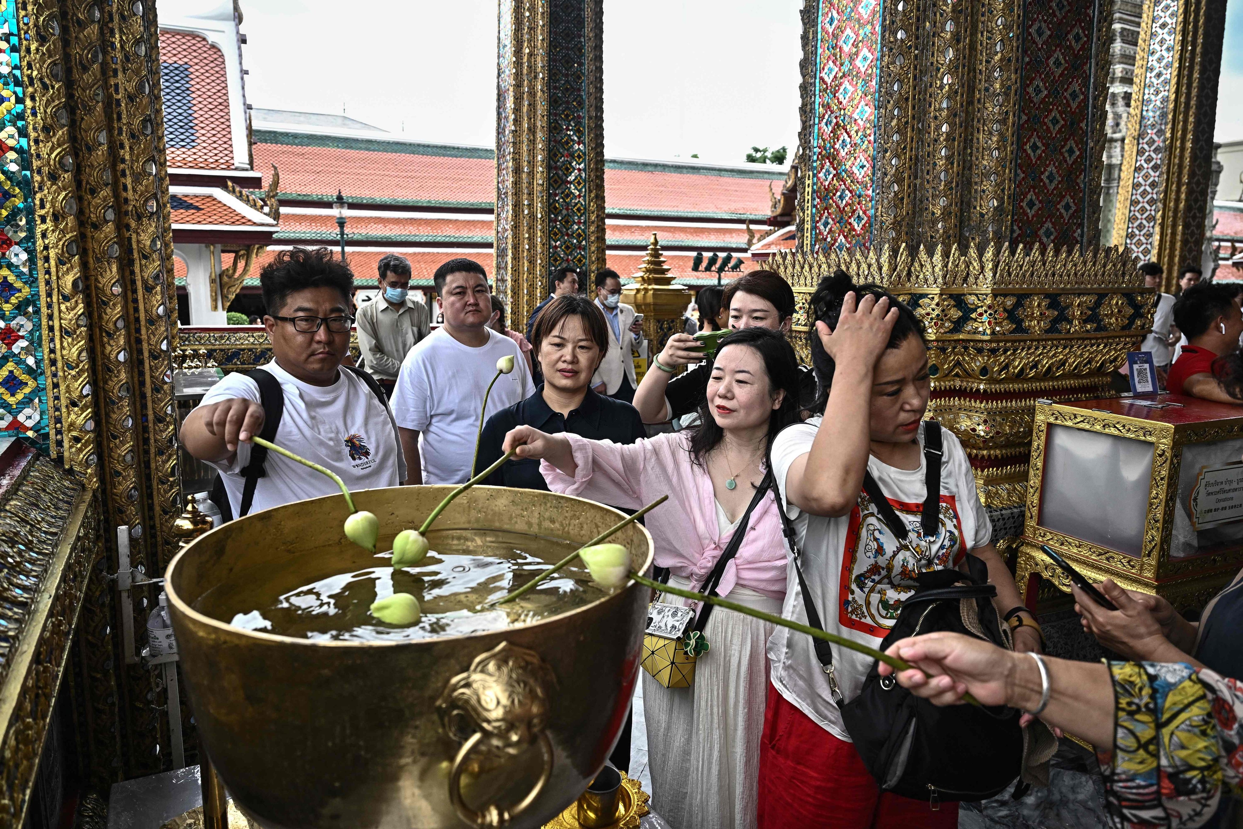 Chinese tourists at the Grand Palace in Bangkok. Visitors from China are the biggest contributor to Thailand’s tourism sector. Photo: AFP