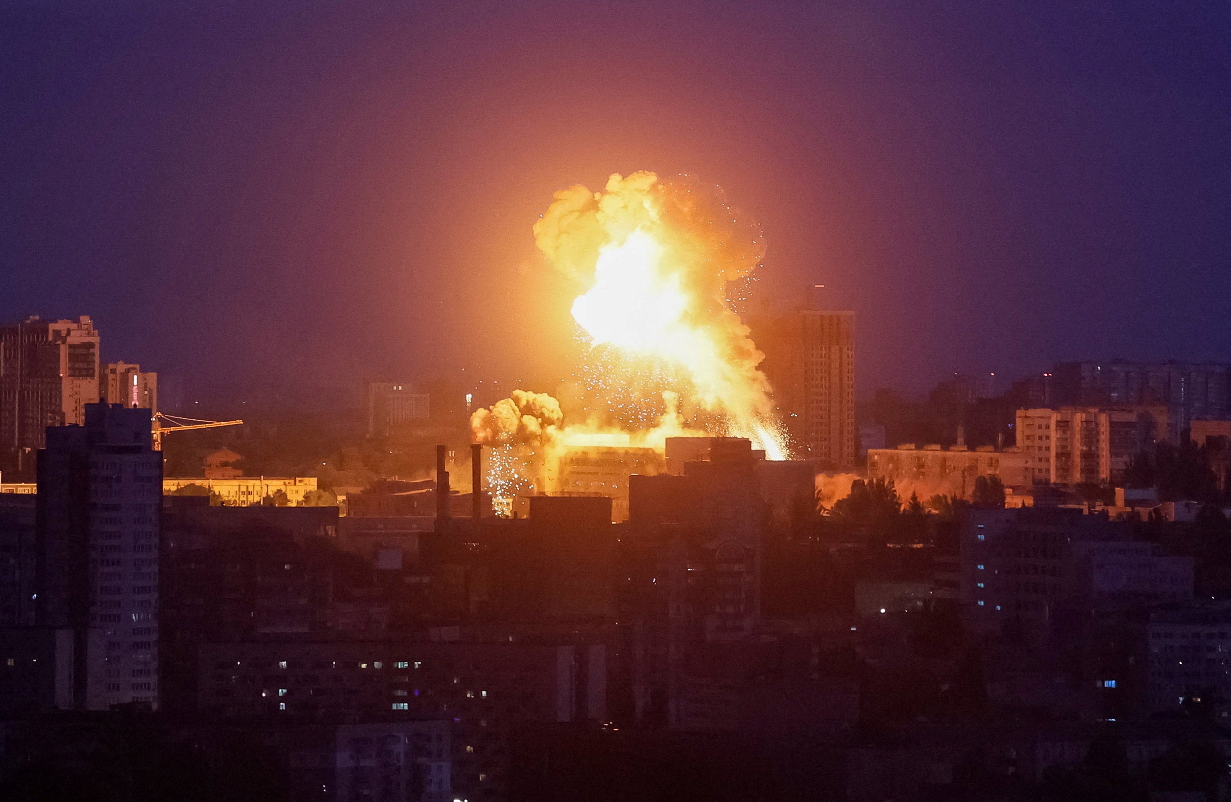 An explosion lights up the sky in Kyiv during a Russian attack on Sunday. Photo: Reuters