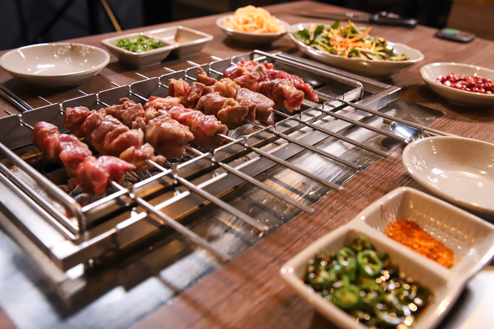 Grilled lamb skewers, above, done barbecue-style are very popular in China. Photo: Shutterstock Grilled lamb skewers, above, done barbecue-style are very popular in China. Photo: Shutterstock