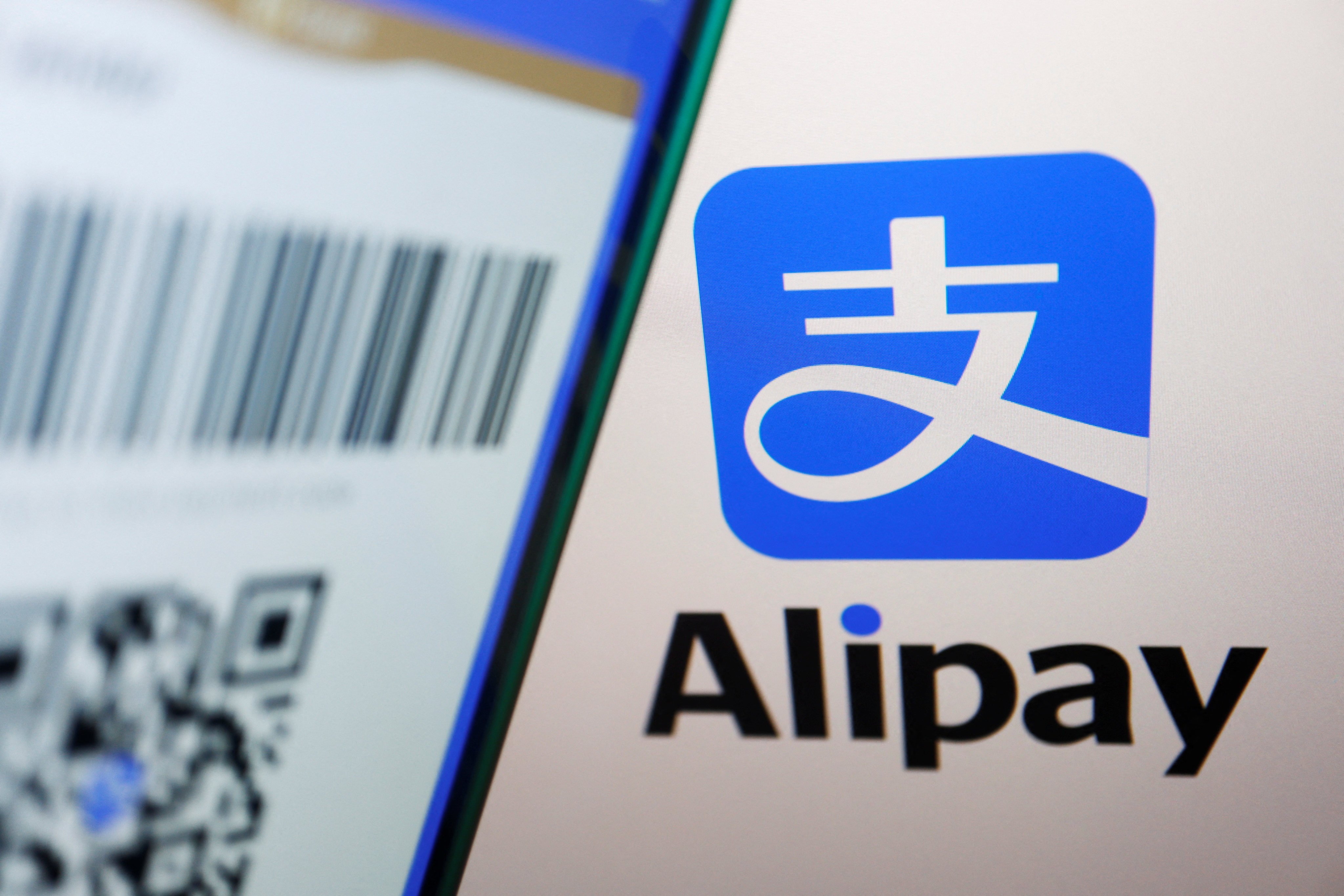 The Alipay logo is displayed next to a QR payment code on the app. Photo: Reuters