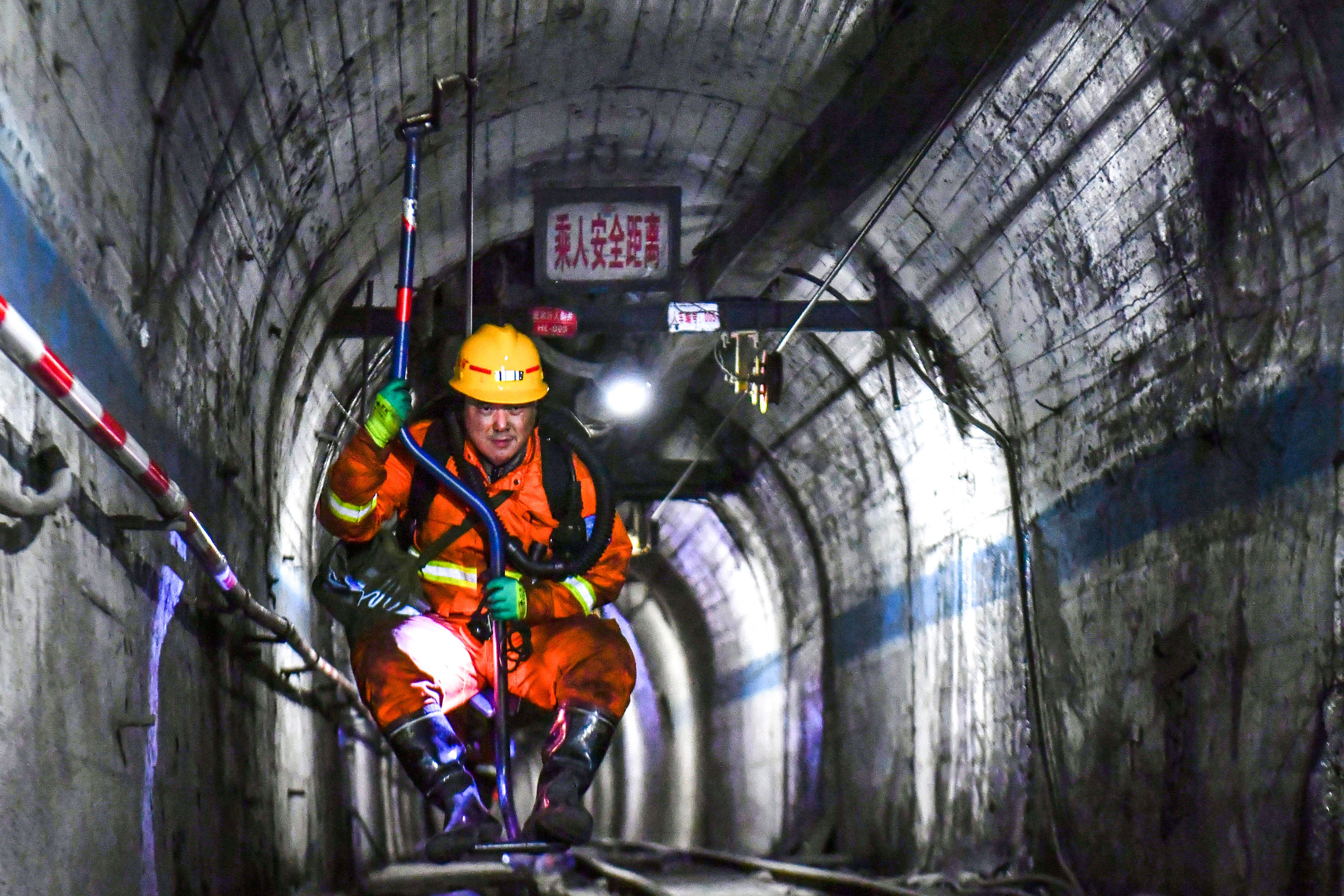 In this photo released by Xinhua News Agency, a rescuer comes up from the coal mine shaft after conducting search and rescue operation following a gas explosion at the Liushenyu coal mine facility in Qinyuan county in Changzhi, northern China's Shanxi province on Sunday, May 24, 2026. (Cao Yang/Xinhua via AP)