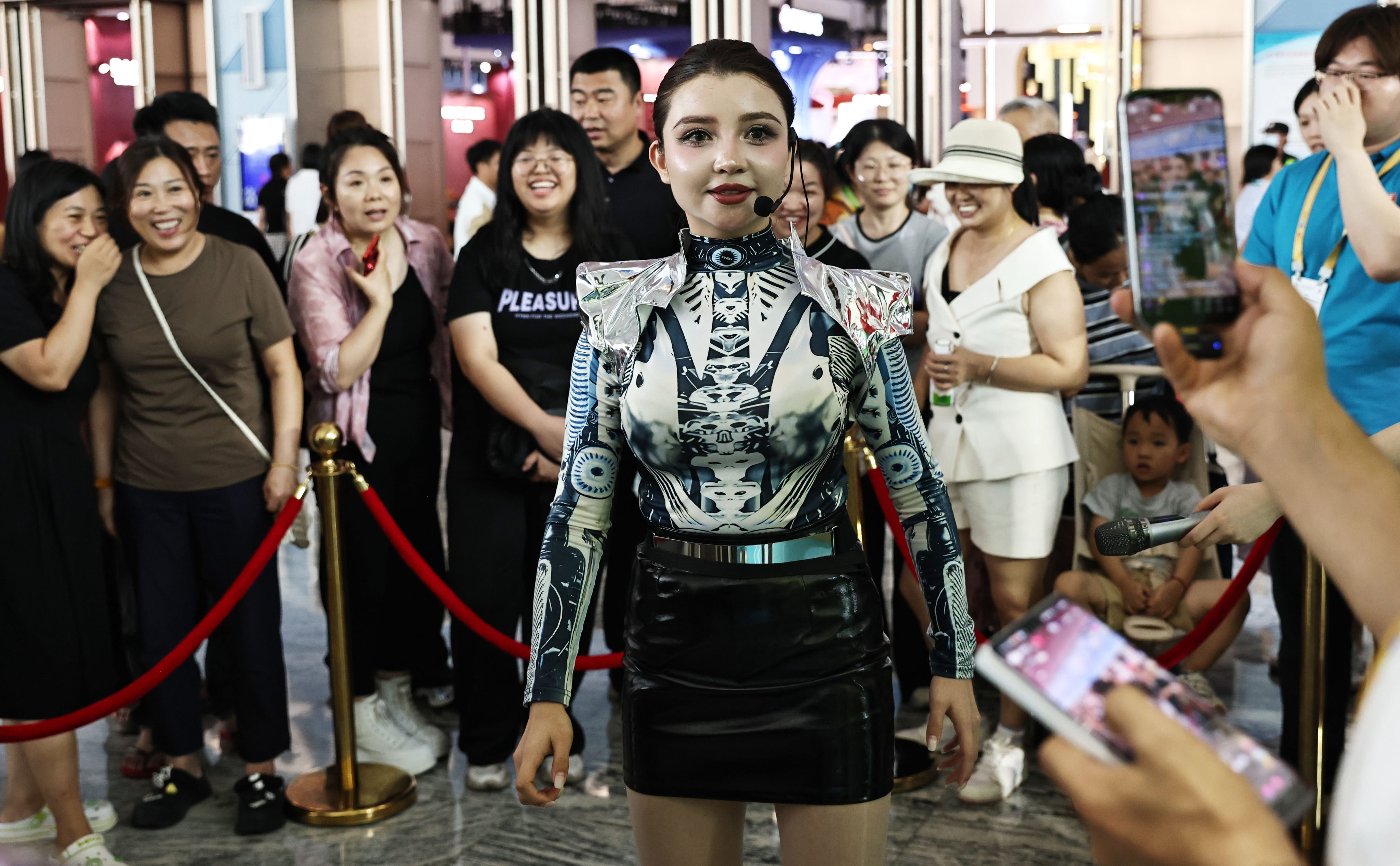 An AI humanoid robot interacts with visitors at a business expo in China’s southern Hainan province. Photo: Xinhua
