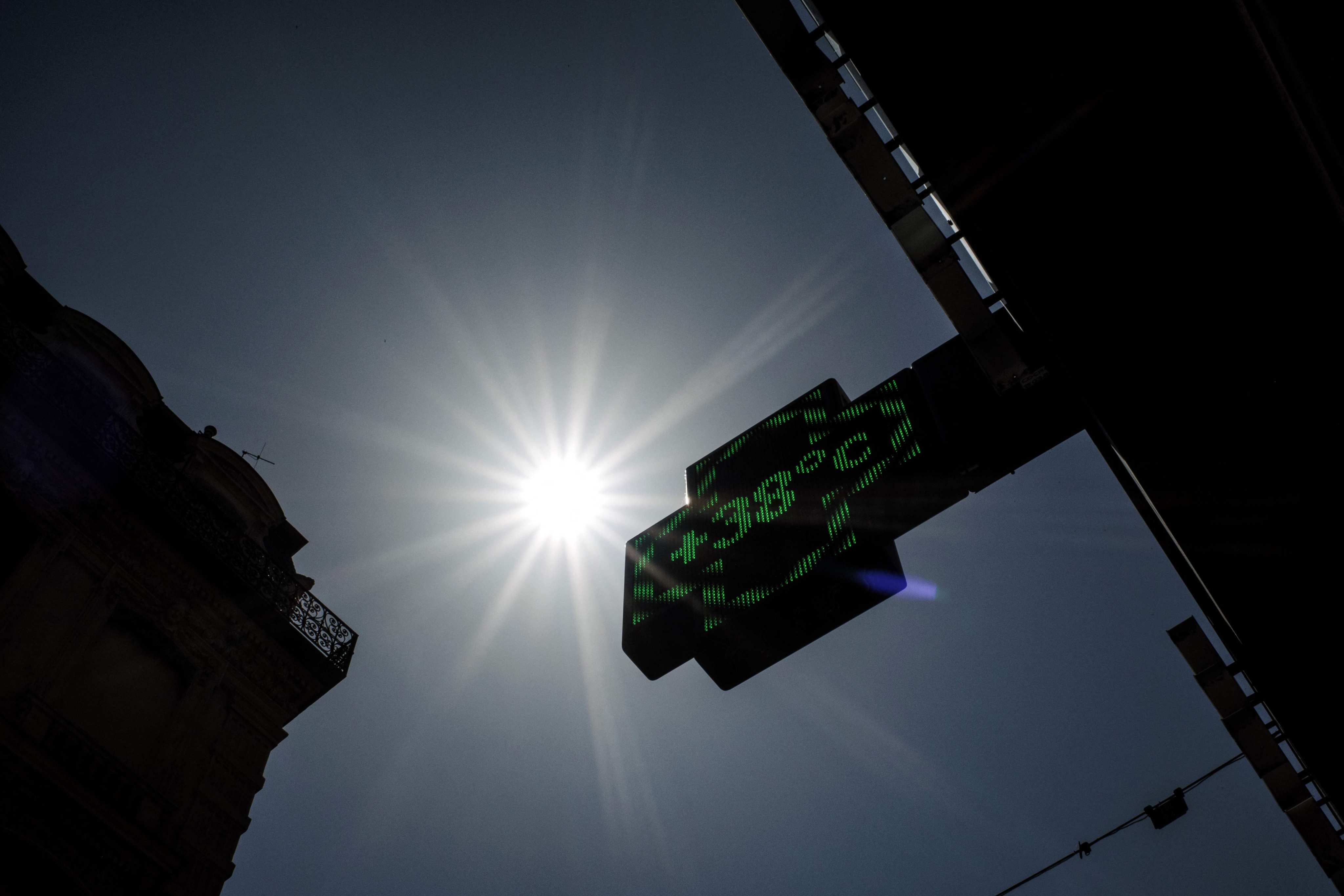 A pharmacy thermometer sign reading 38 degrees Celsius in Lyon on Tuesday, as a heatwave hits France. Photo: AFP